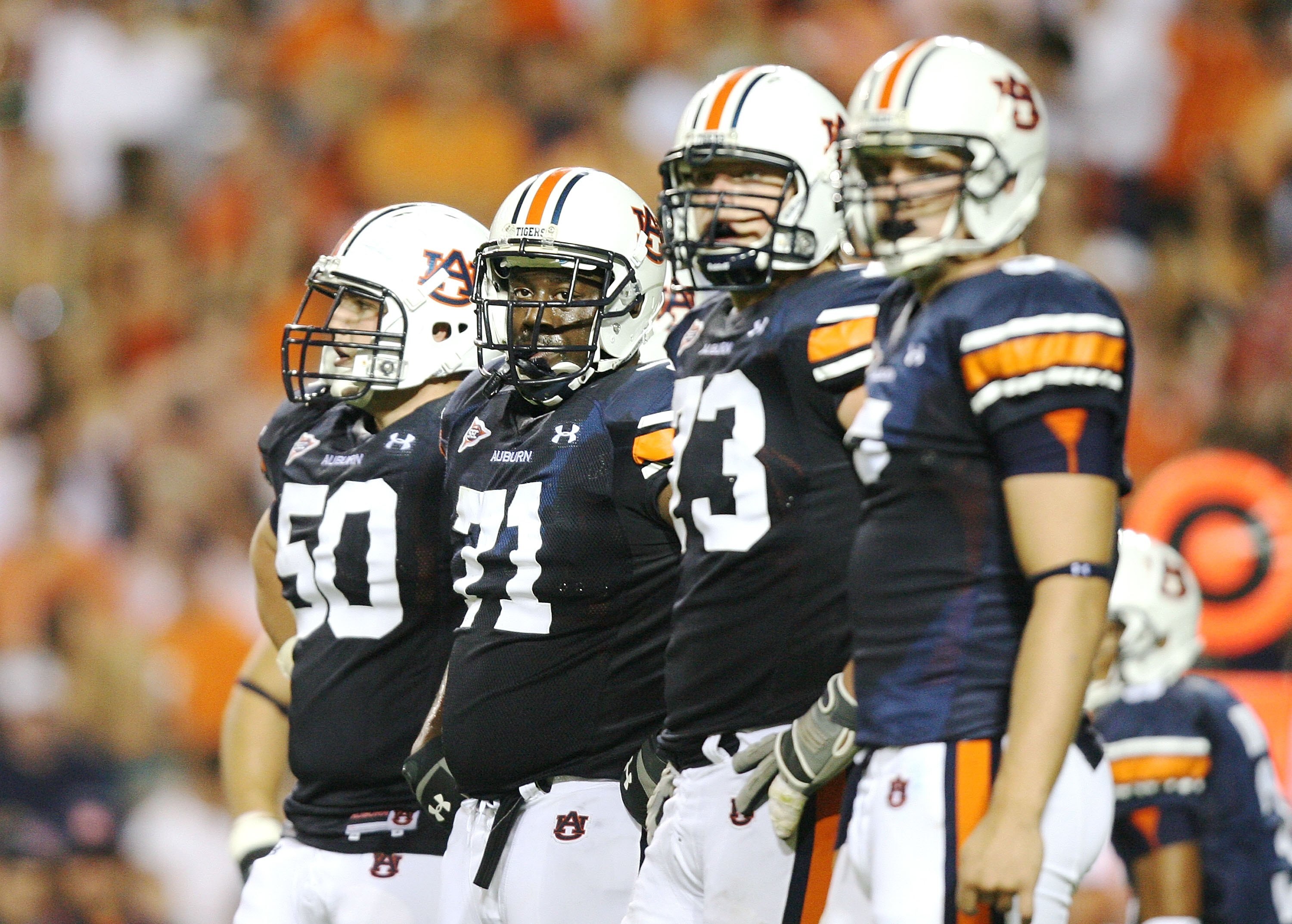 AUBURN, AL - SEPTEMBER 20: Offensive lineman Ryan Pugh #50, Tyronne Green #71, Lee Ziemba #73 and tight end Tommy Trott #5 of the Auburn Tigers prepare for a play while taking on the LSU Tigers at Jordan-Hare Stadium on September 20, 2008 in Auburn, Alab AUBURN, AL - SEPTEMBER 20: Offensive lineman Ryan Pugh #50, Tyronne Green #71, Lee Ziemba #73 and tight end Tommy Trott #5 of the Auburn Tigers prepare for a play while taking on the LSU Tigers at Jordan-Hare Stadium on September 20, 2008 in Auburn, Alab