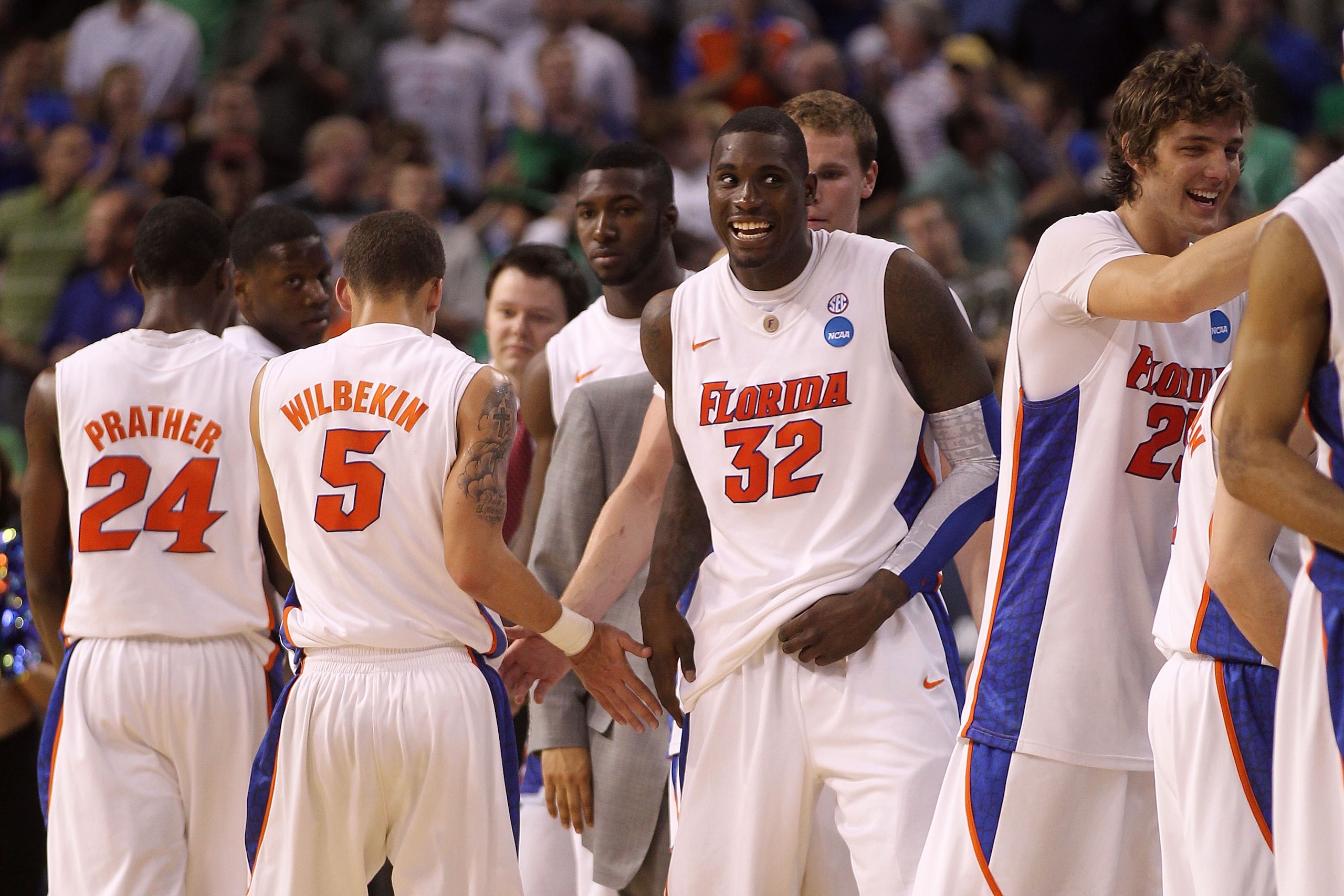 TAMPA, FL - MARCH 17:  Vernon Macklin #32 and Chandler Parsons #25 of the Florida Gators celebrate with their teammates after their 79-51 win against the UC Santa Barbara Gauchos during the second round of the 2011 NCAA men's basketball tournament at St.