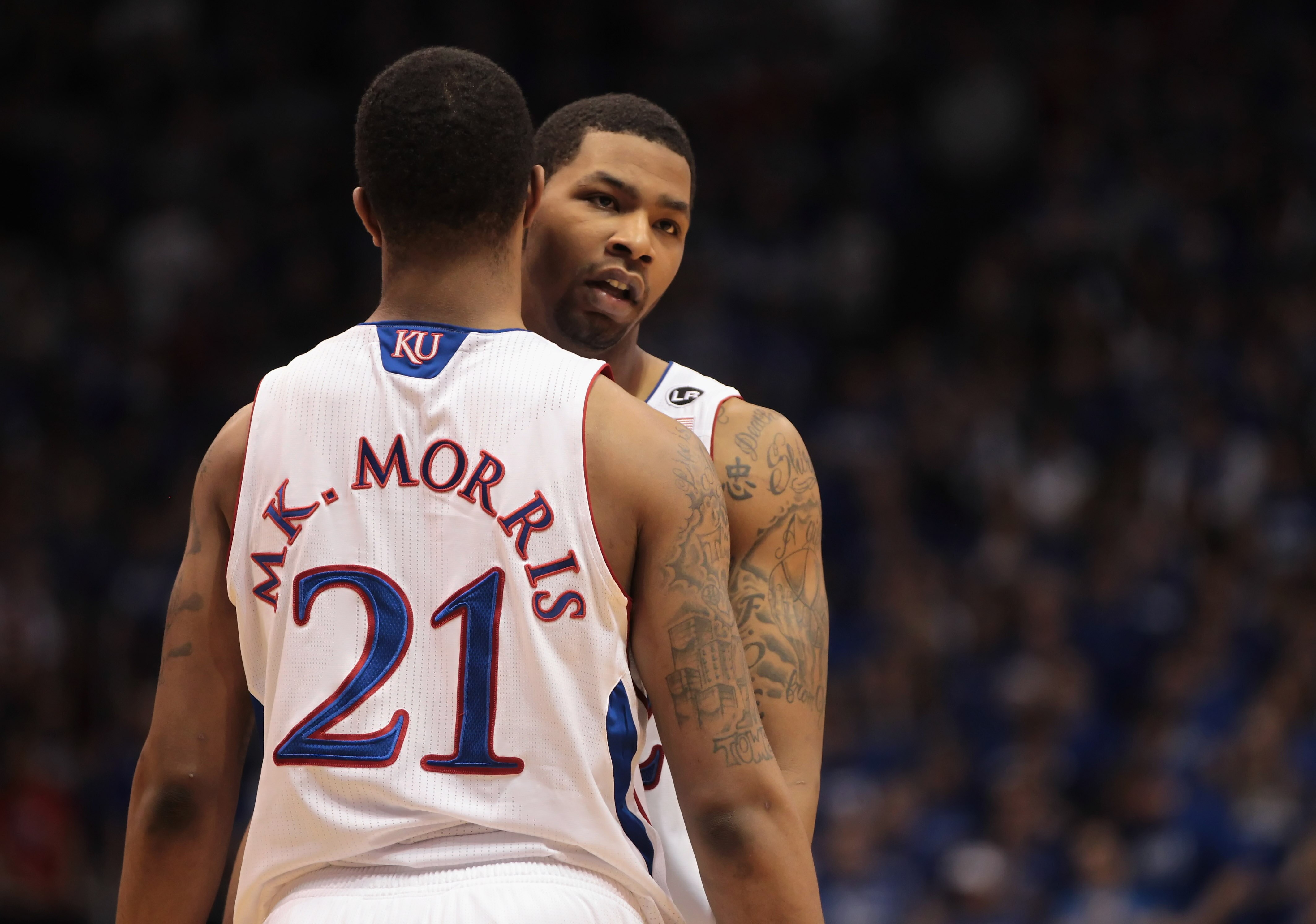 LAWRENCE, KS - FEBRUARY 12:  Marcus Morris #22 of the Kansas Jayhawks hugs his brother Markieff Morris #21 during the game against the Iowa State Cyclones on February 12, 2011 at Allen Fieldhouse in Lawrence, Kansas.  (Photo by Jamie Squire/Getty Images)