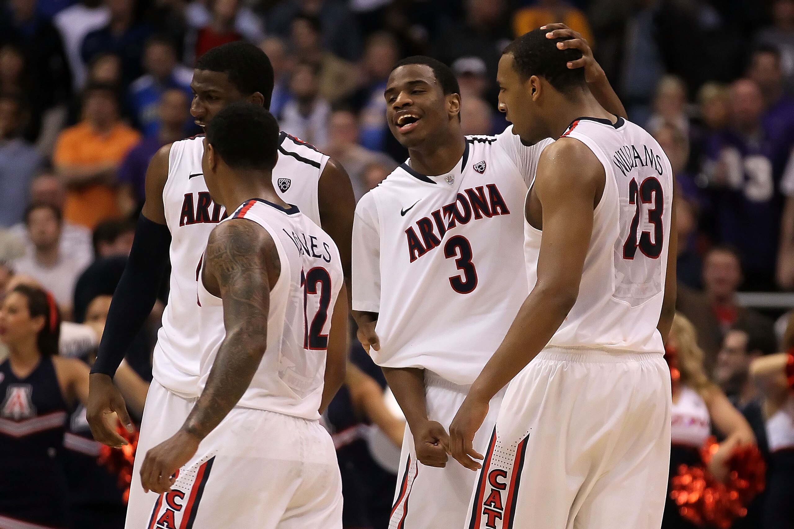 LOS ANGELES, CA - MARCH 12:  (R-L) Derrick Williams #23 and Kevin Parrom #3 of the Arizona Wildcats react alongside teammates Lamont Jones #12 and Solomon Hill #44 while taking on the Washington Huskies in the championship game of the 2011 Pacific Life Pa