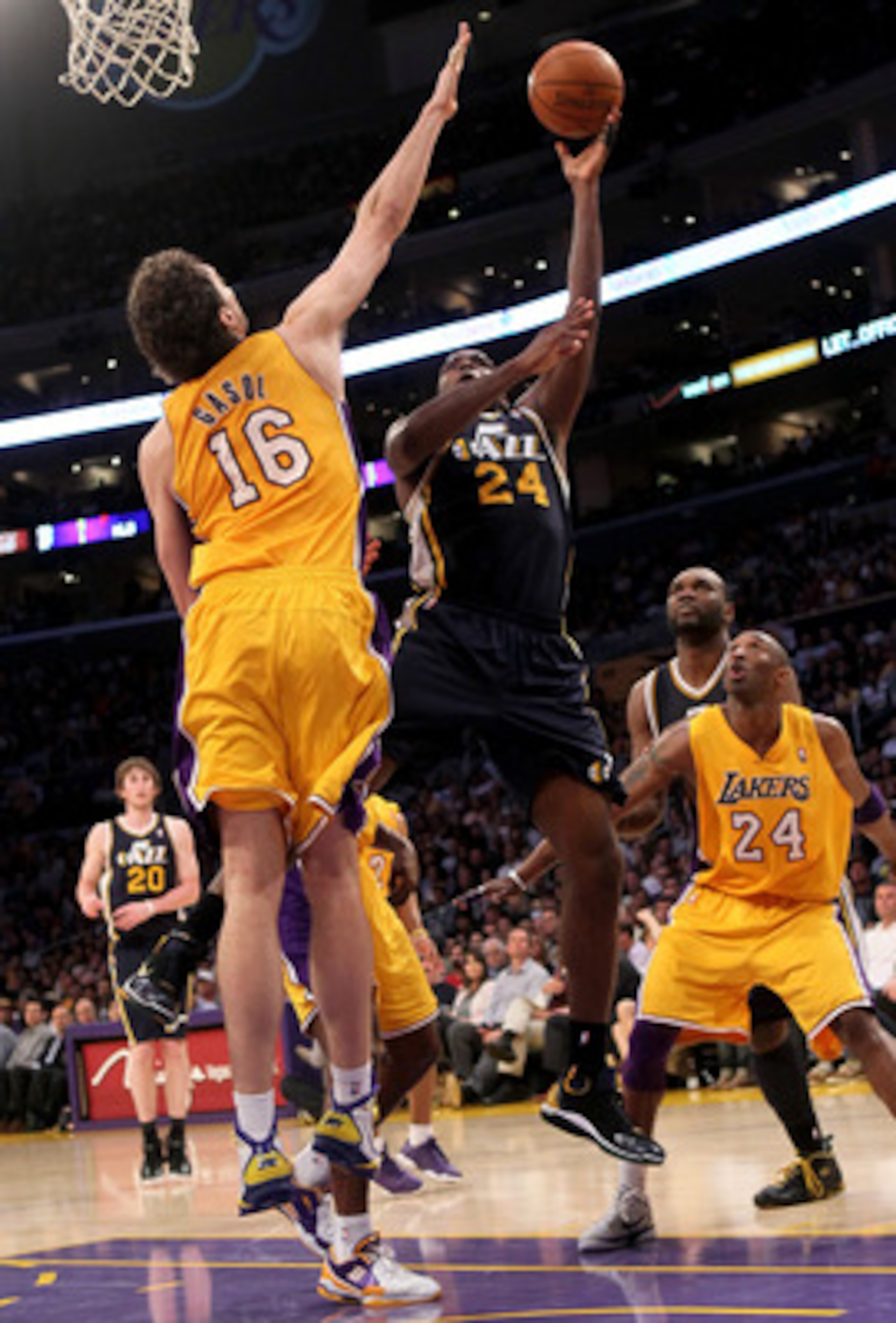 LOS ANGELES, CA - APRIL 05:  Paul Milsap #24 of the Utah Jazz shoots over Pau Gasol #16 of the Los Angeles Lakers at Staples Center on April 5, 2011 in Los Angeles, California. The Jazz won 86-85.  NOTE TO USER: User expressly acknowledges and agrees that