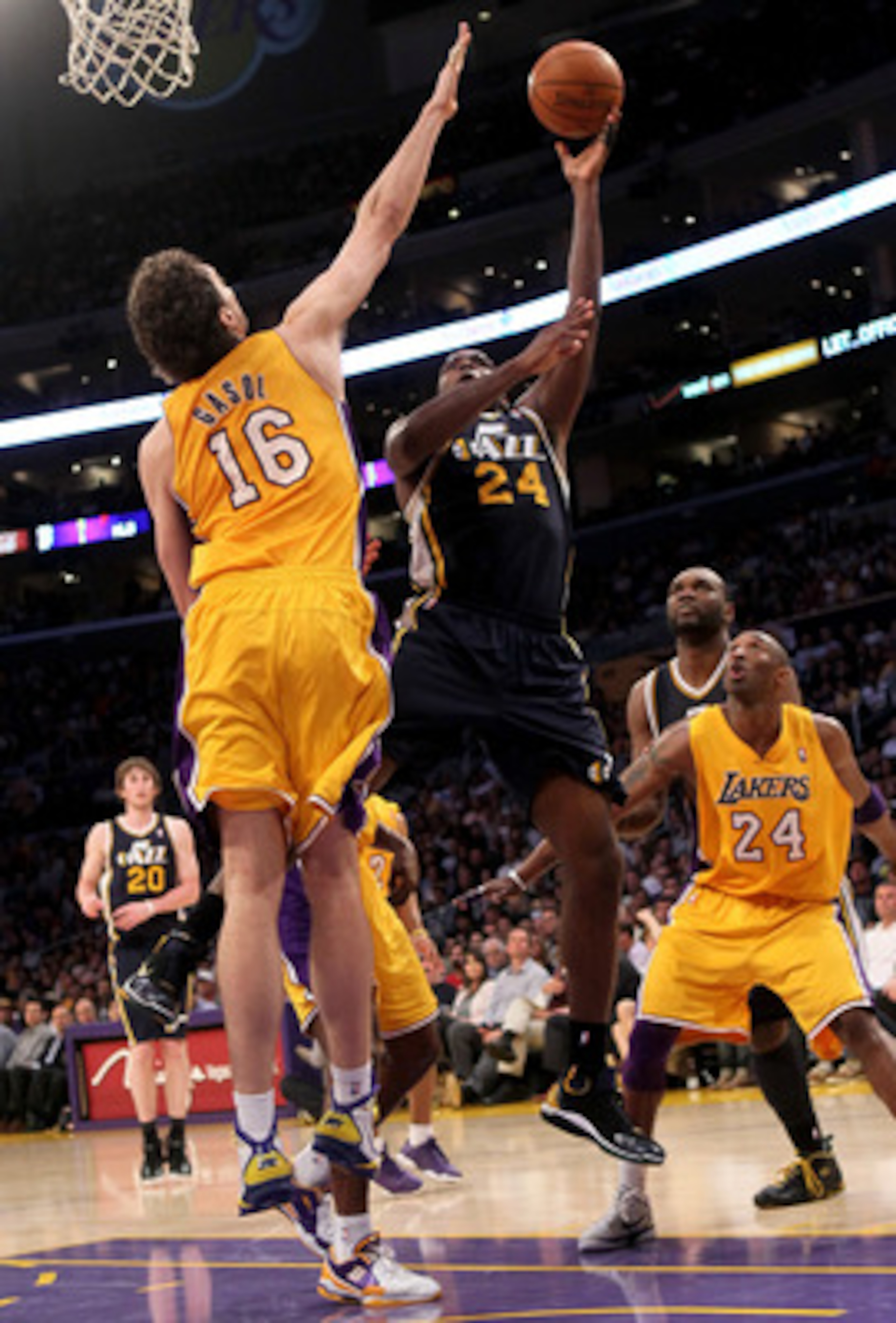 LOS ANGELES, CA - APRIL 05:  Paul Milsap #24 of the Utah Jazz shoots over Pau Gasol #16 of the Los Angeles Lakers at Staples Center on April 5, 2011 in Los Angeles, California. The Jazz won 86-85.  NOTE TO USER: User expressly acknowledges and agrees that