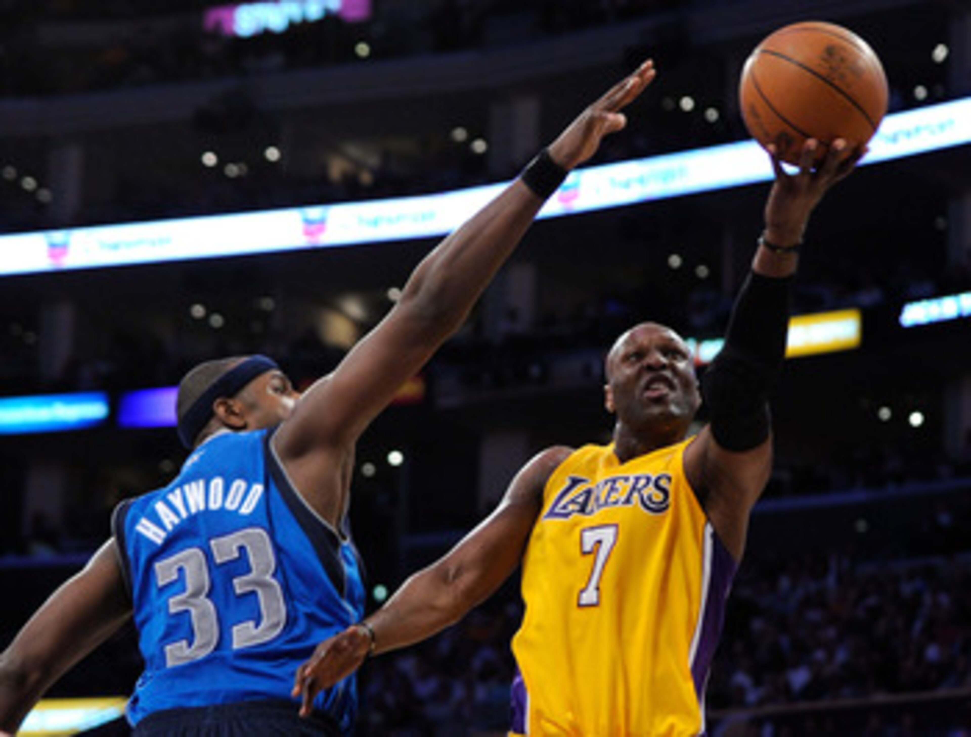 LOS ANGELES, CA - MAY 04:  Lamar Odom #7 of the Los Angeles Lakers goes up for a shot against Brendan Haywood #33 of the Dallas Mavericks in the second half in Game Two of the Western Conference Semifinals in the 2011 NBA Playoffs at Staples Center on May