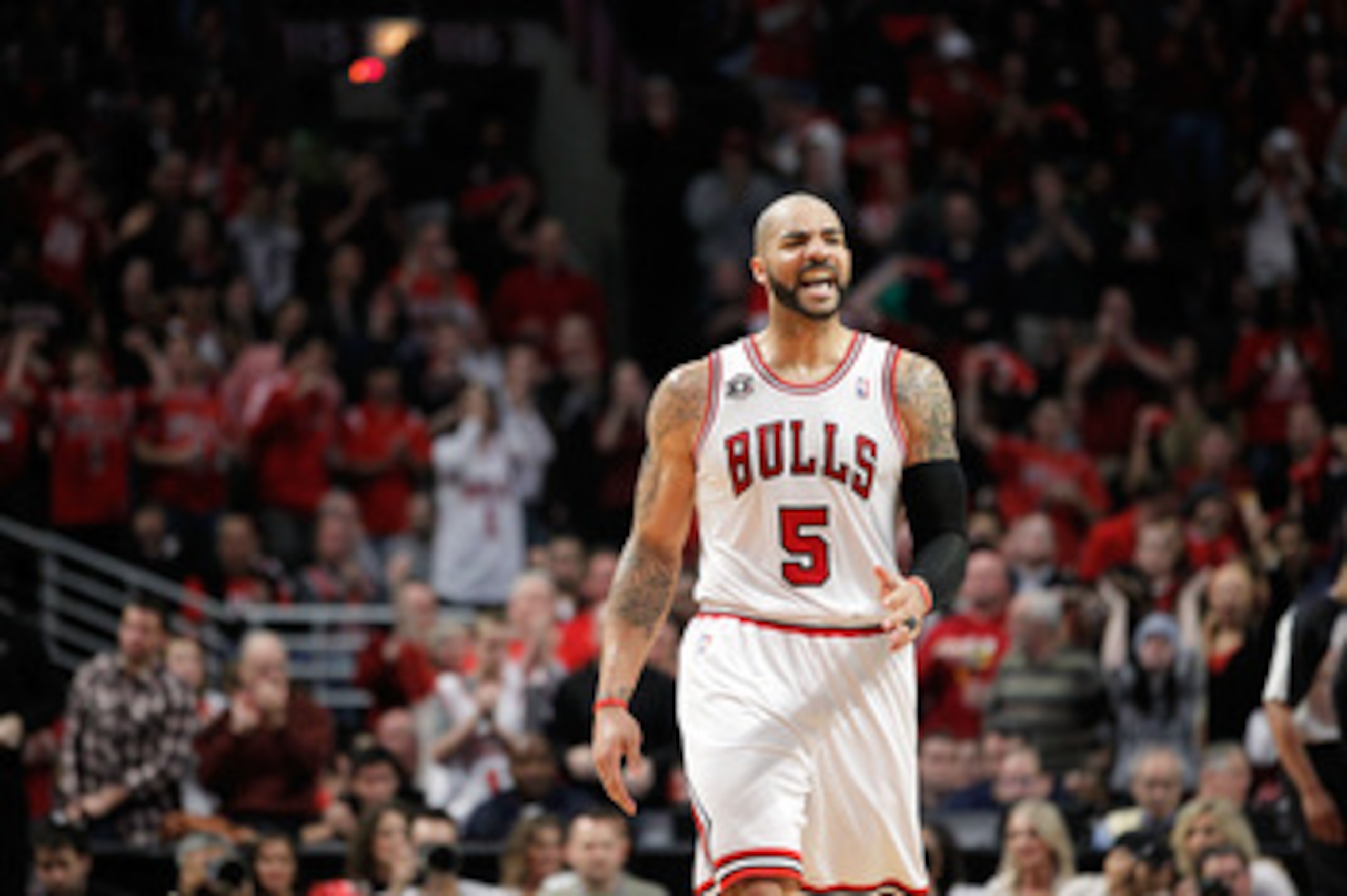 CHICAGO, IL - MAY 15:  Carlos Boozer #5 of the Chicago Bulls reacts against the Miami Heat in Game One of the Eastern Conference Finals during the 2011 NBA Playoffs on May 15, 2011 at the United Center in Chicago, Illinois. The Bulls won 103-82. NOTE TO U