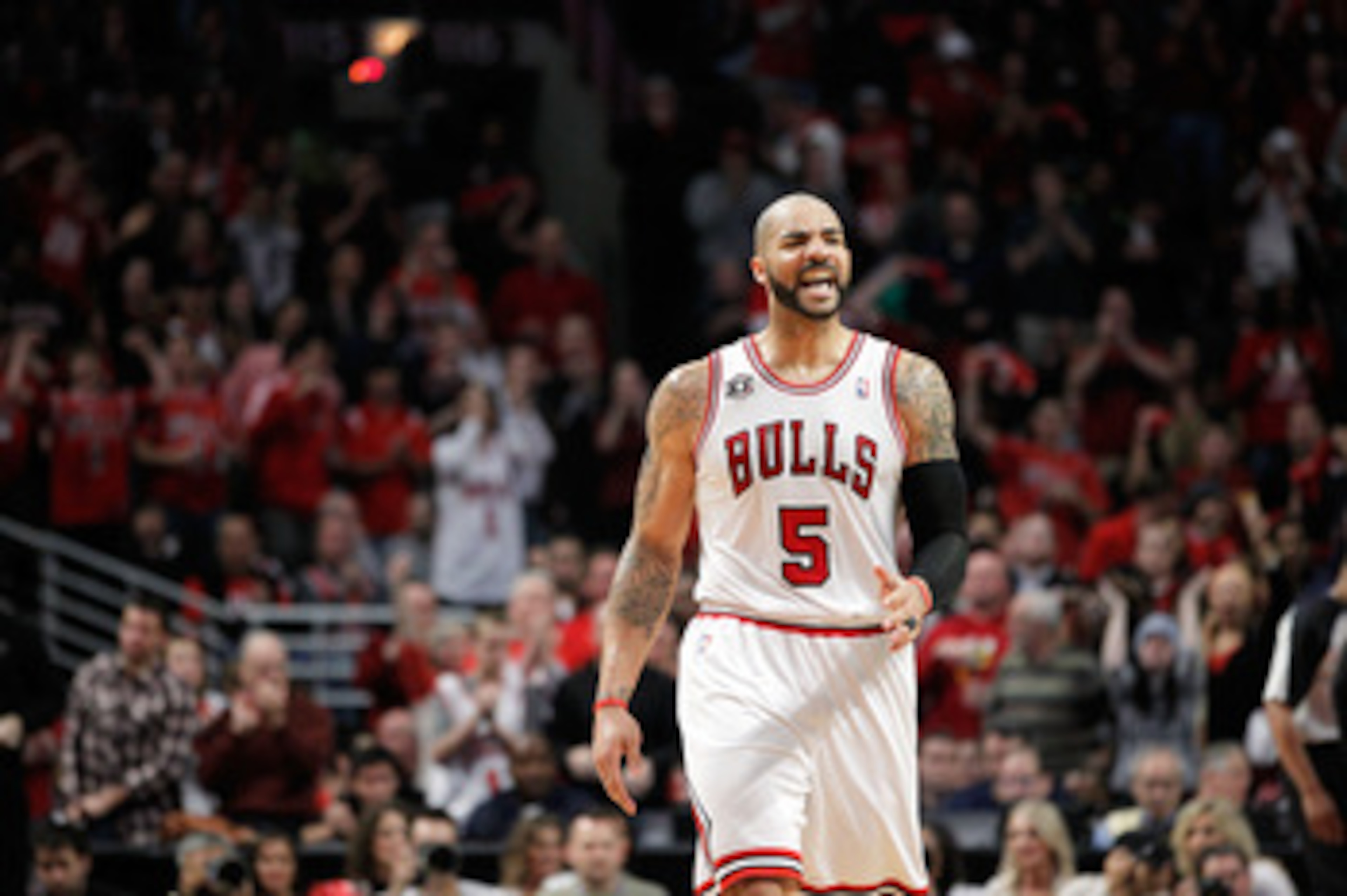 CHICAGO, IL - MAY 15:  Carlos Boozer #5 of the Chicago Bulls reacts against the Miami Heat in Game One of the Eastern Conference Finals during the 2011 NBA Playoffs on May 15, 2011 at the United Center in Chicago, Illinois. The Bulls won 103-82. NOTE TO U