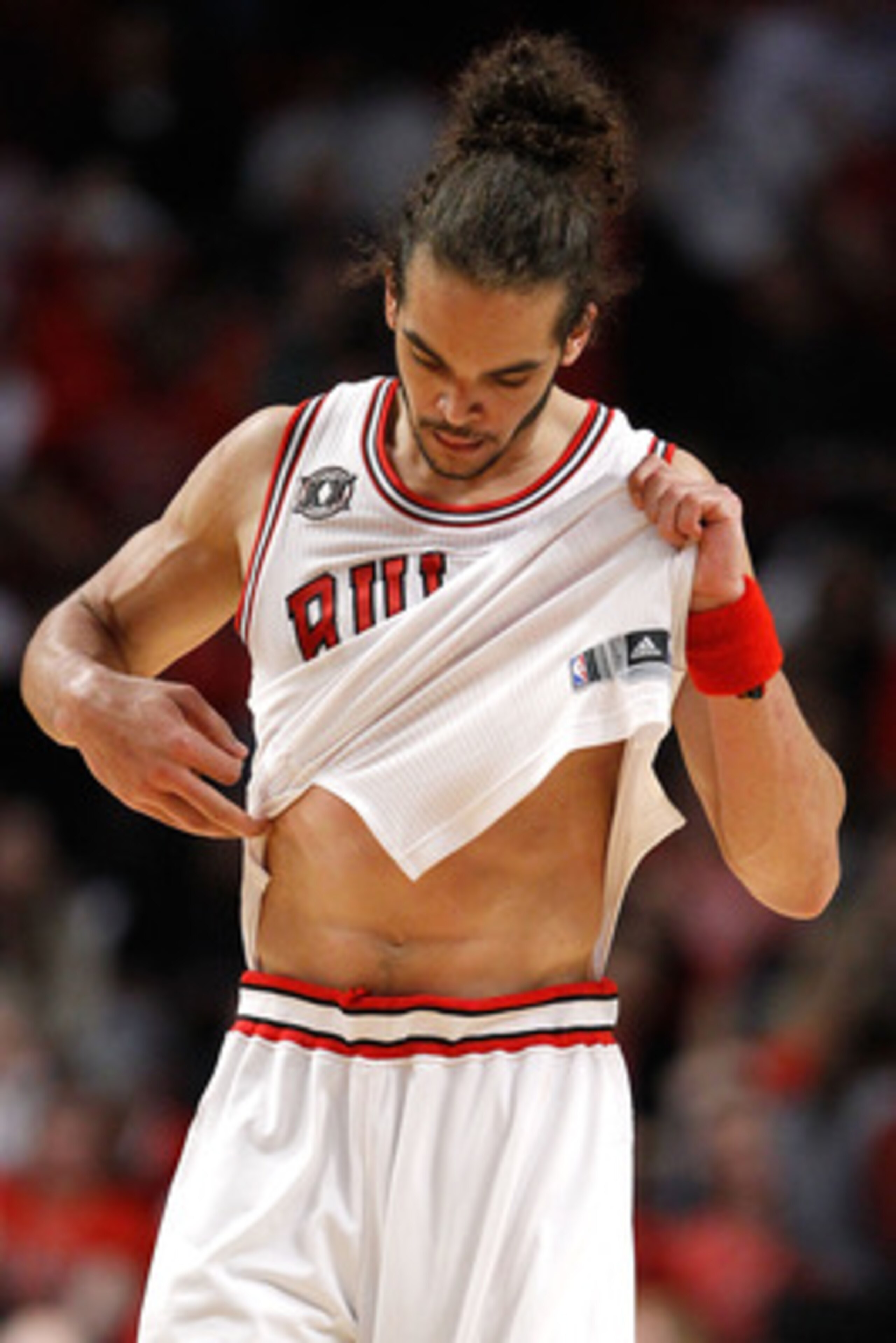 CHICAGO, IL - MAY 18:  Joakim Noah #13 of the Chicago Bulls looks on dejected against the Miami Heat in Game Two of the Eastern Conference Finals during the 2011 NBA Playoffs on May 18, 2011 at the United Center in Chicago, Illinois. The Miami Heat won 85