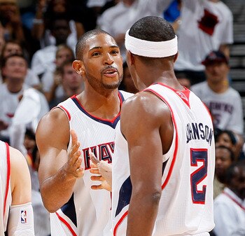 ATLANTA, GA - APRIL 24:  Al Horford #15 of the Atlanta Hawks celebrates after a basket against the Orlando Magic with Kirk Hinrich #6 and Joe Johnson #2 during Game Four of the Eastern Conference Quarterfinals in the 2011 NBA Playoffs at Philips Arena on