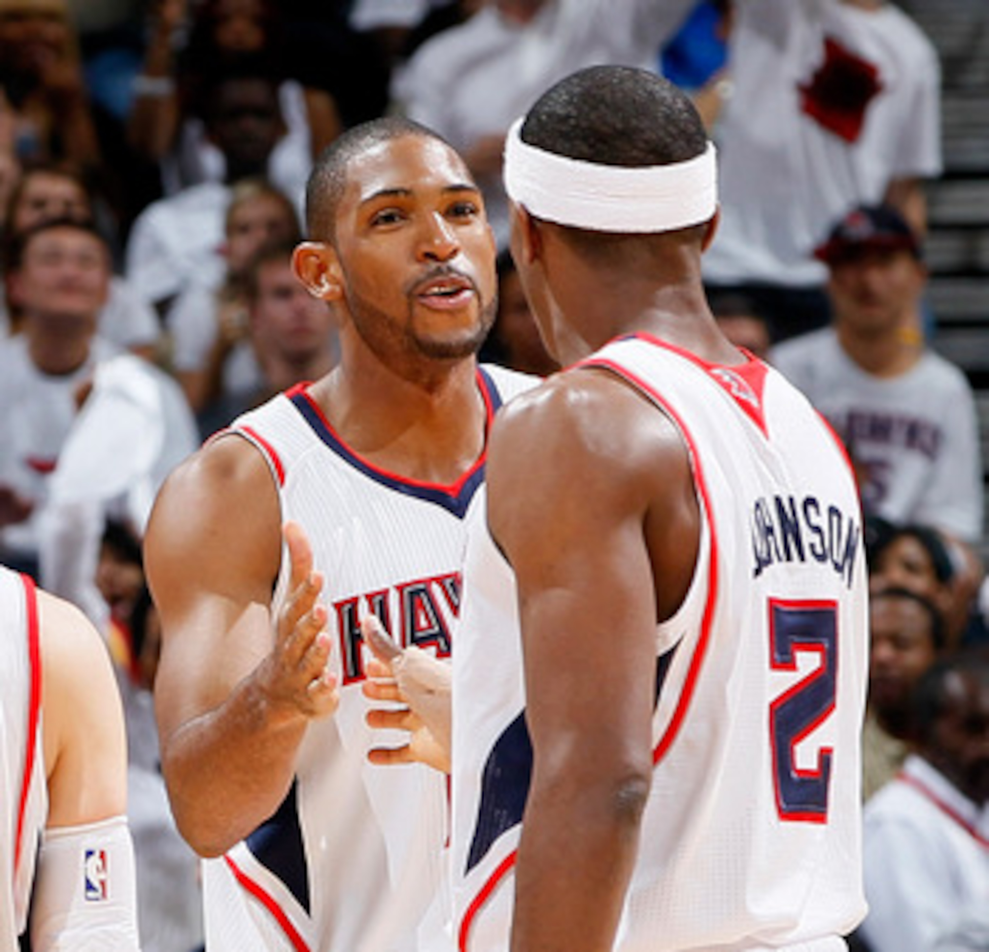 ATLANTA, GA - APRIL 24:  Al Horford #15 of the Atlanta Hawks celebrates after a basket against the Orlando Magic with Kirk Hinrich #6 and Joe Johnson #2 during Game Four of the Eastern Conference Quarterfinals in the 2011 NBA Playoffs at Philips Arena on