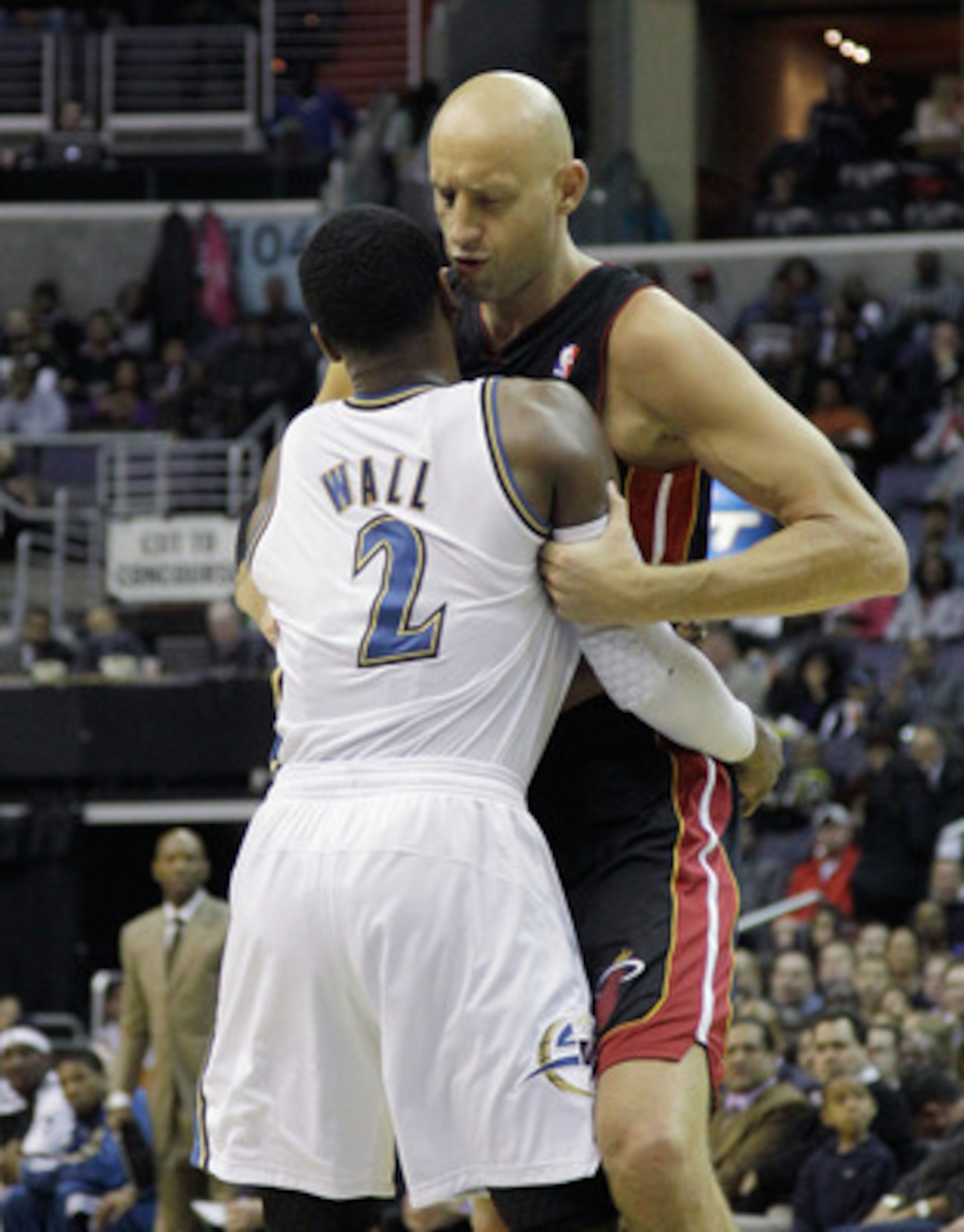 WASHINGTON, DC - MARCH 30:  John Wall #2 of the Washington Wizards and Zydrunas Ilgauskas #11 of the Miami Heat exchange words at the Verizon Center on March 30, 2011 in Washington, DC. NOTE TO USER: User expressly acknowledges and agrees that, by downloa