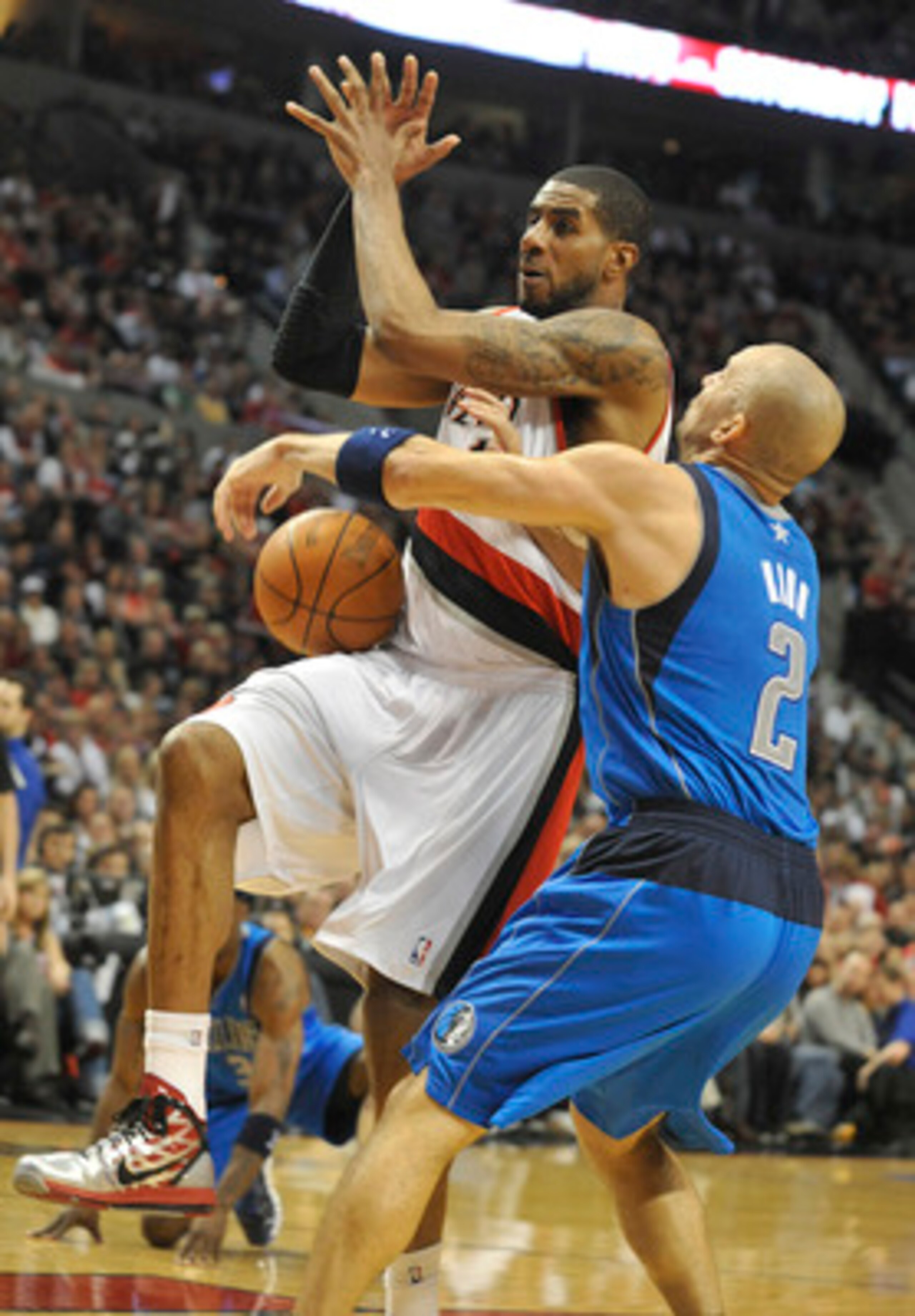PORTLAND, OR - APRIL 28: LaMarcus Aldridge #12 of the Portland Trail Blazers is fouled by Jason Kidd #2 of the Dallas Mavericks during the fourth quarter of Game Six of the Western Conference Quartefinals in the 2011 NBA Playsoffs on April 28, 2011 at the