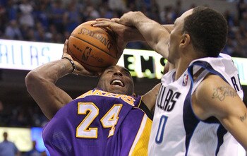 DALLAS, TX - MAY 08:  Guard Kobe Bryant #24 of the Los Angeles Lakers is fouled by Shawn Marion #0 of the Dallas Mavericks in Game Four of the Western Conference Semifinals during the 2011 NBA Playoffs on May 8, 2011 at American Airlines Center in Dallas,