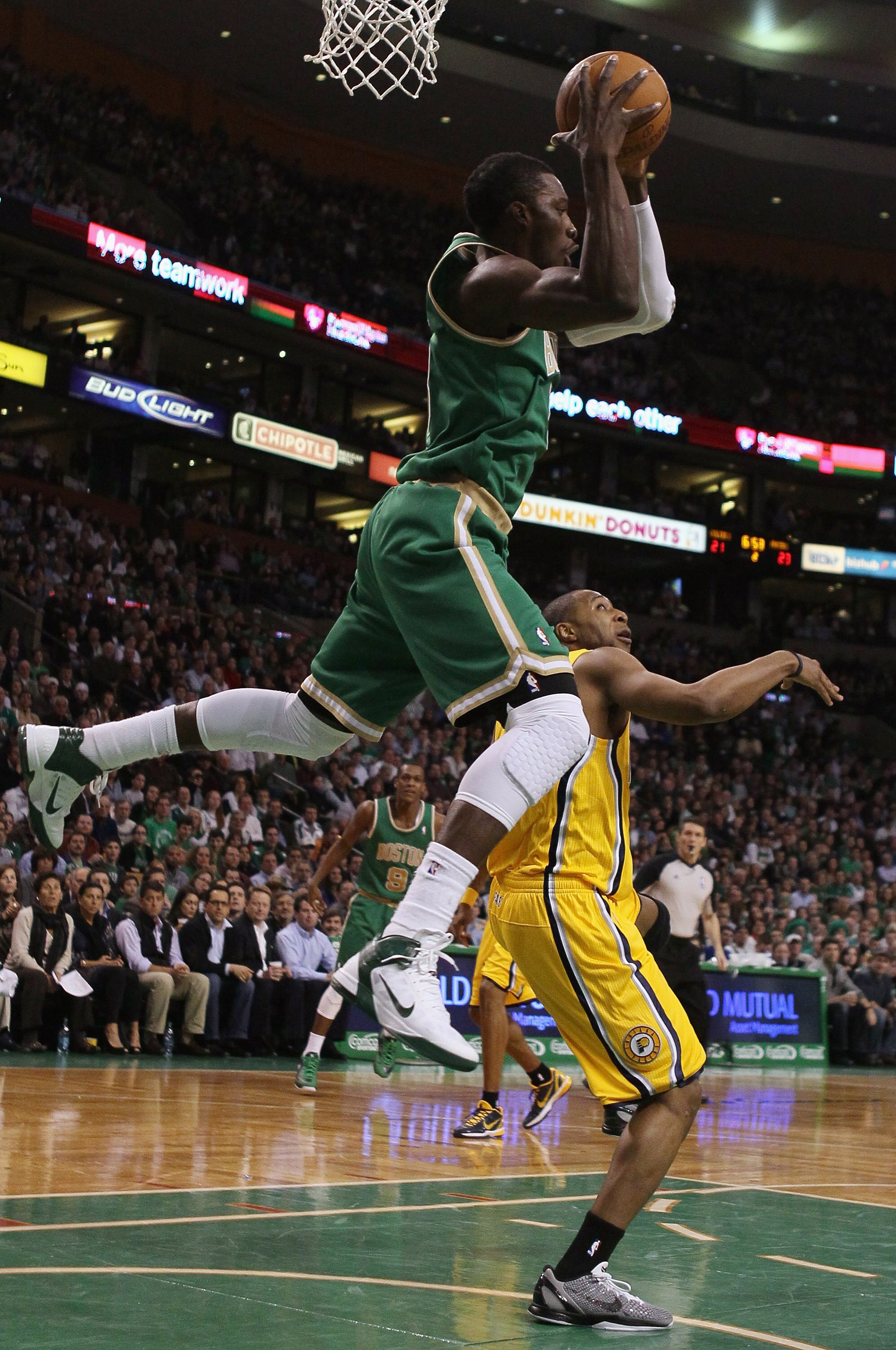 BOSTON, MA - MARCH 16:  Jeff Green #8 of the Boston Celtics grabs a pass as A.J. Price #12 of the Indiana Pacers defends on March 16, 2011 at the TD Garden in Boston, Massachusetts.  NOTE TO USER: User expressly acknowledges and agrees that, by downloadin