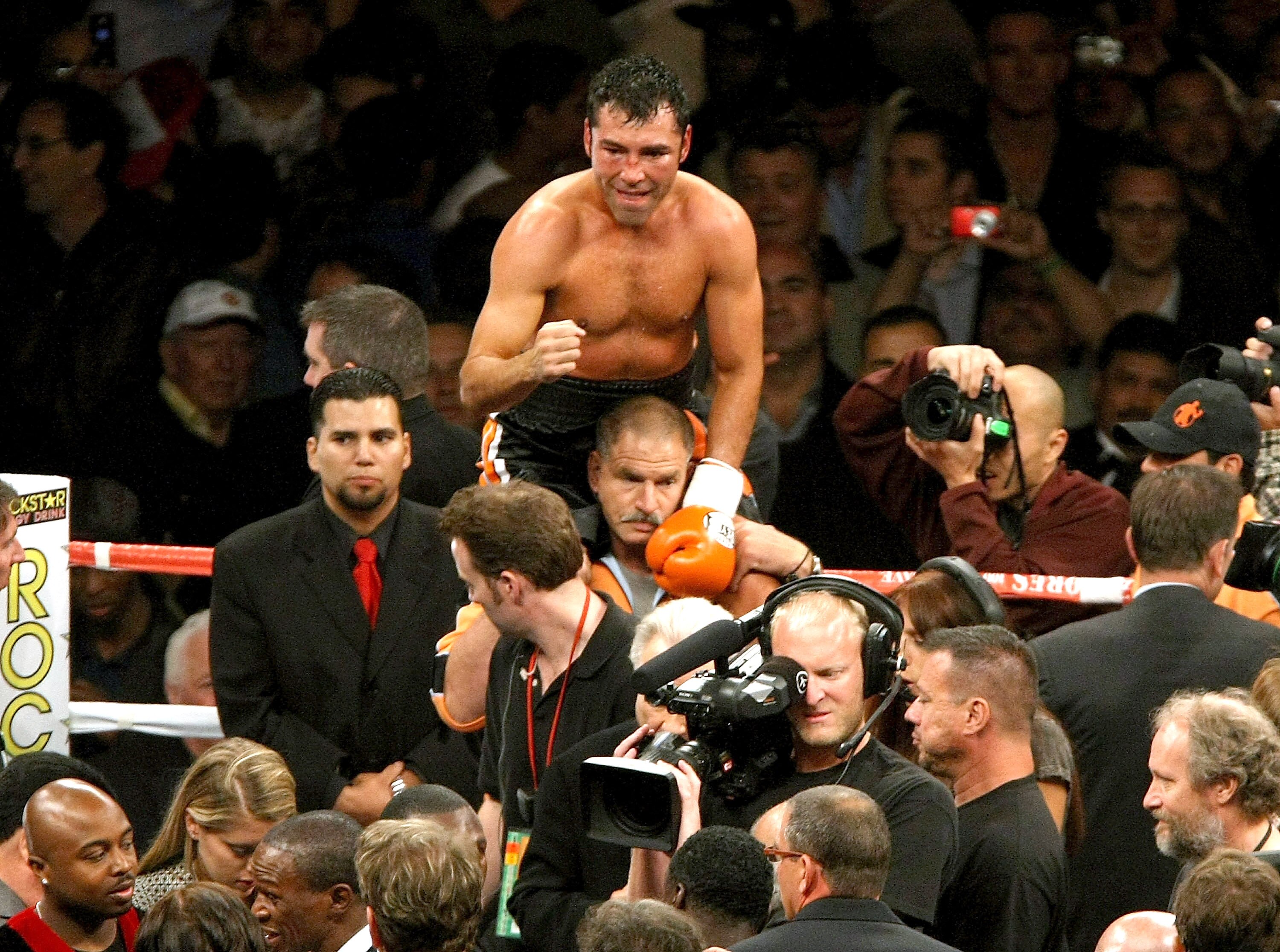 CARSON, CA - MAY 3:  Oscar De La Hoya celebrates after getting the decision over Steve Forbes during their junior middleweight bout at the Home Depot Center on May 3, 2008 in Carson, California.  (Photo by Stephen Dunn/Getty Images)