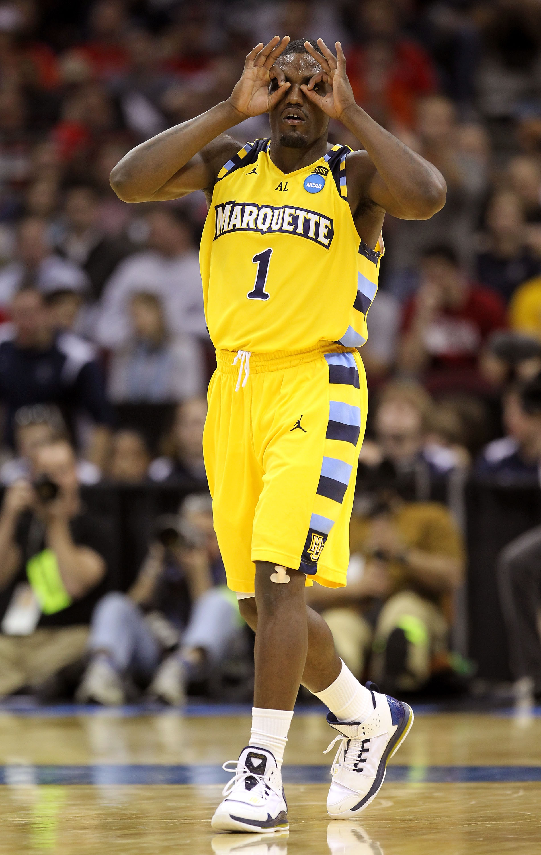 CLEVELAND, OH - MARCH 18:  Darius Johnson-Odom #1 of the Marquette Golden Eagles gestures after making a three point basket against the Xavier Musketeers during the second round of the 2011 NCAA men's basketball tournament at Quicken Loans Arena on March 