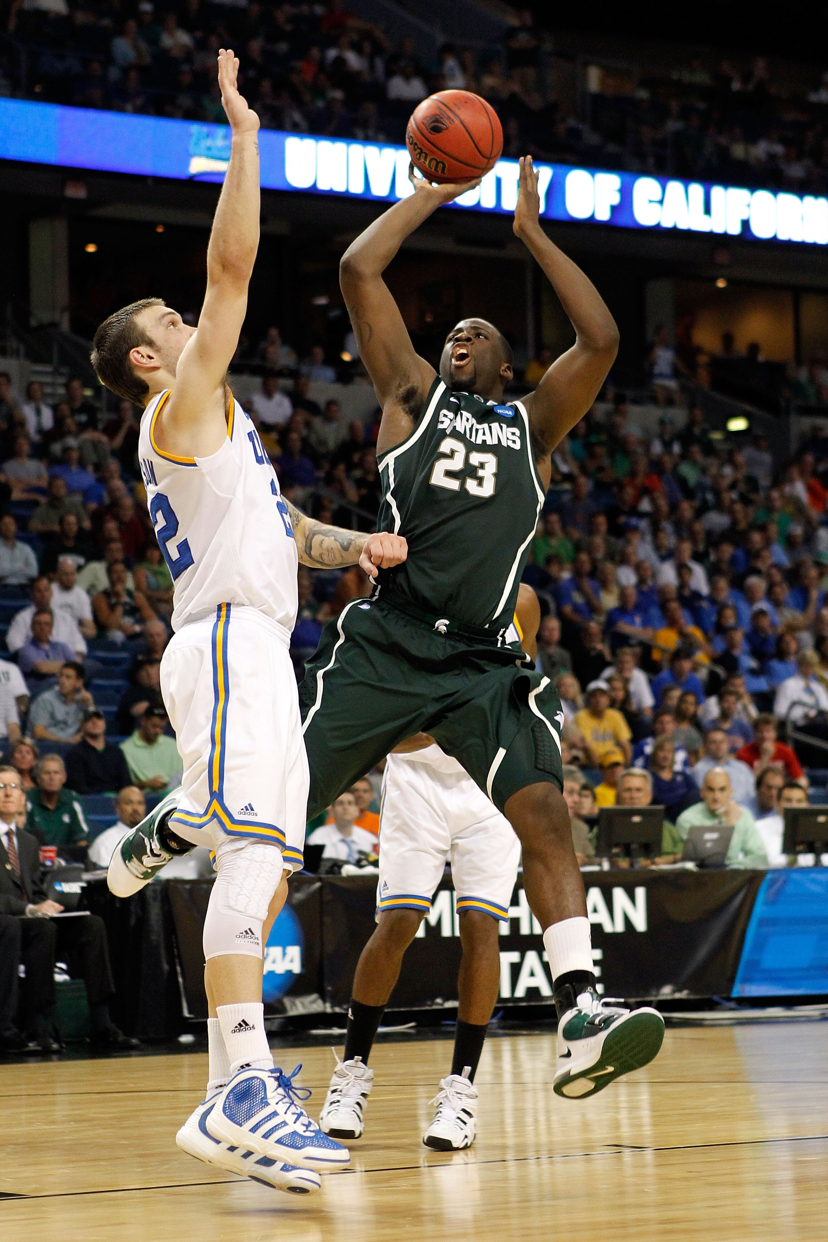 TAMPA, FL - MARCH 17:  Draymond Green #23 of the Michigan State Spartans attempts a shot in the second half against Reeves Nelson #22 of the UCLA Bruins during the second round of the 2011 NCAA men's basketball tournament at St. Pete Times Forum on March