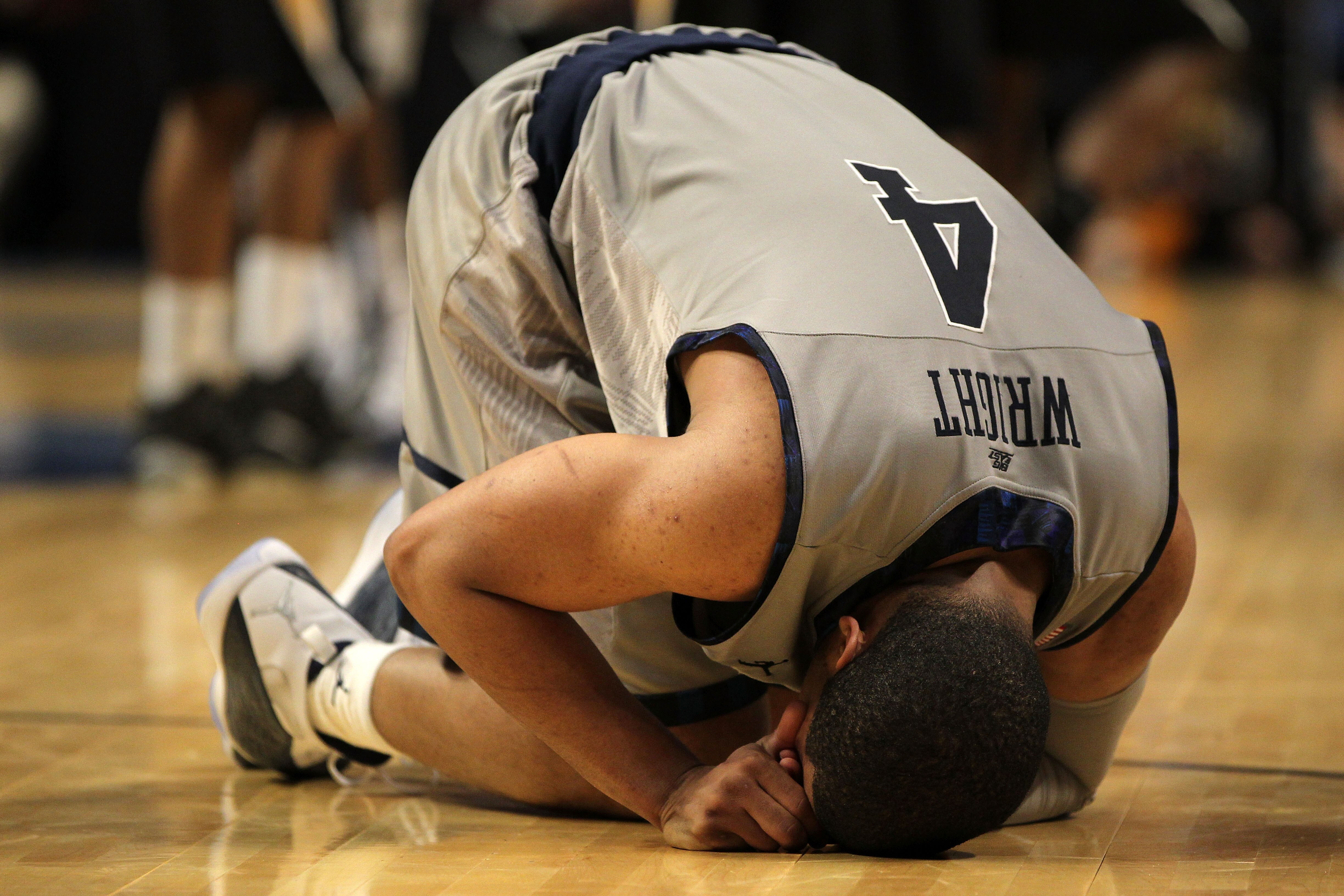 CHICAGO, IL - MARCH 18:  Chris Wright #4 of the Georgetown Hoyas reacts after losing to the Virginia Commonwealth Rams during the second round of the 2011 NCAA men's basketball tournament at the United Center on March 18, 2011 in Chicago, Illinois. Virgin