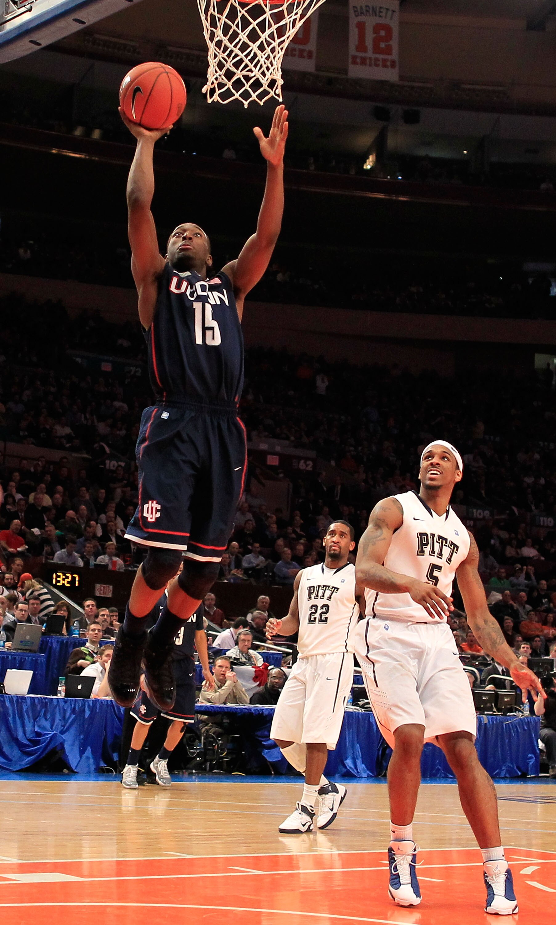 NEW YORK, NY - MARCH 10: Kemba Walker #15 of the Connecticut Huskies drives to the basket against Gilbert Brown #5 of the Pittsburgh Panthers during the quarterfinals of the 2011 Big East Men's Basketball Tournament presented by American Eagle Outfitters