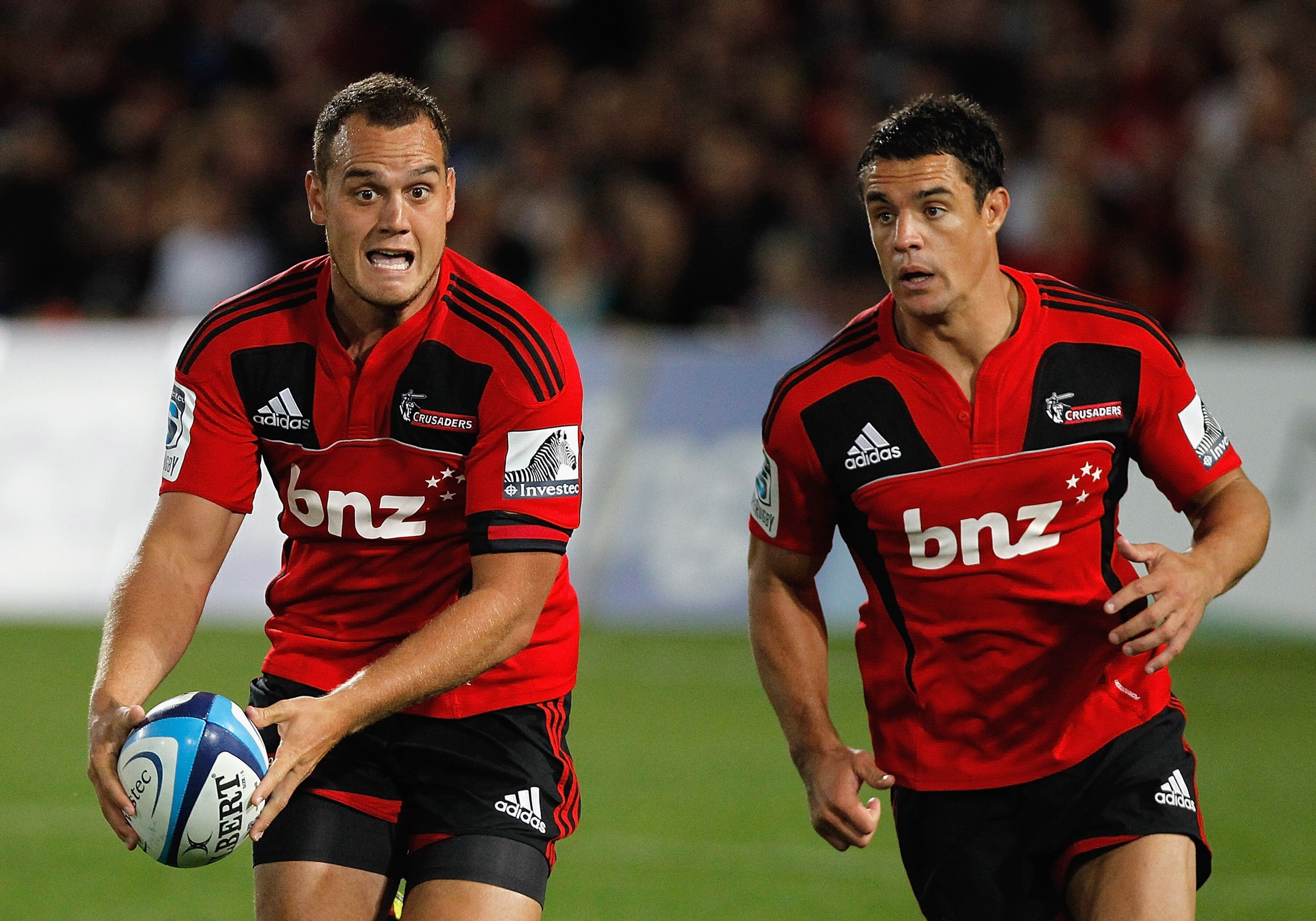 NELSON, NEW ZEALAND - MARCH 11:  Israel Dagg (L) of the Crusaders makes a break with team mate Dan Carter during the round four Super Rugby match between the Crusaders and the Brumbies at Trafalgar Park on March 11, 2011 in Nelson, New Zealand.  (Photo by