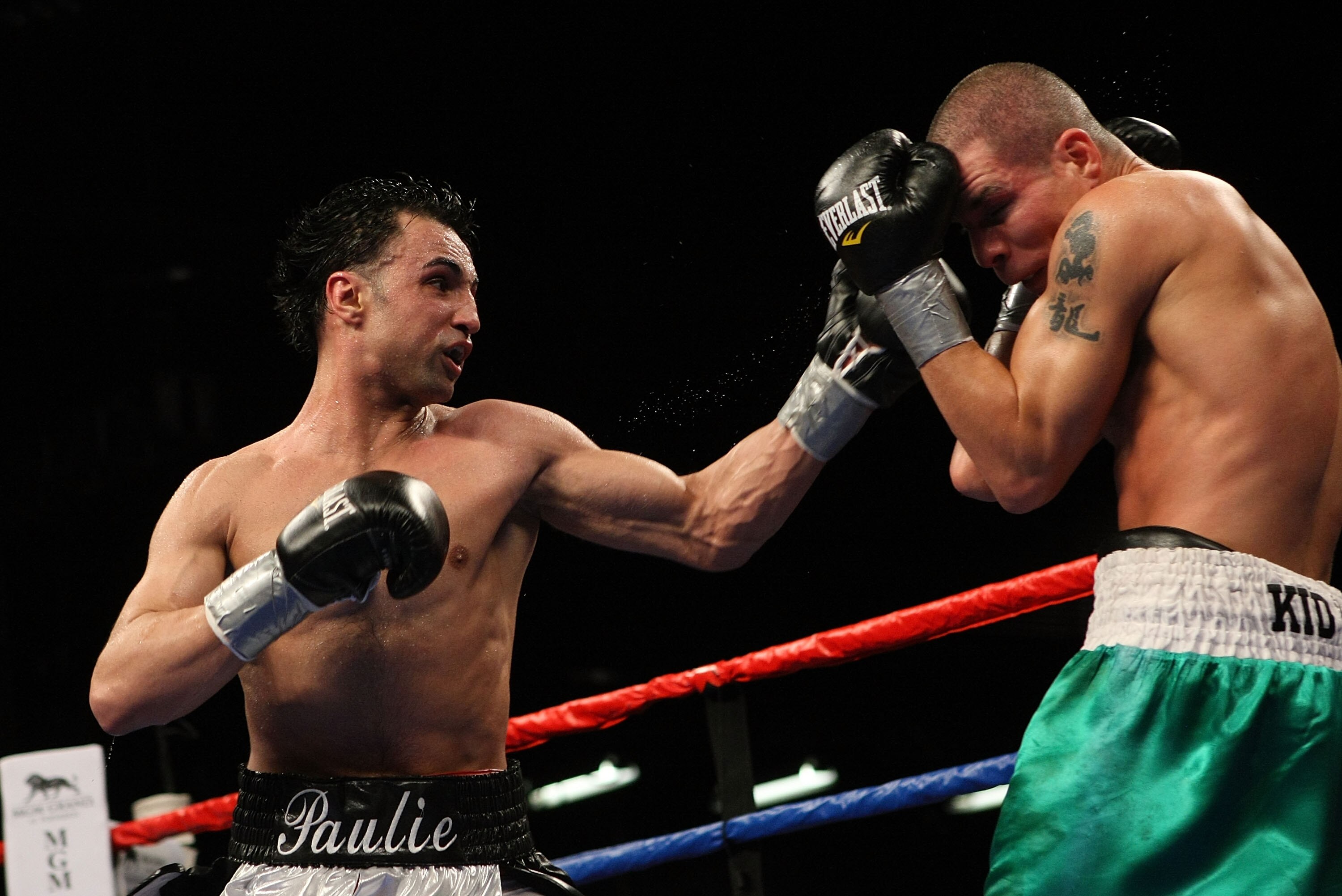 MASHANTUCKET, CT - APRIL 25:  Paulie Malignaggi lands a left Chris Fernandez during their bout at the MGM Grand at Foxwoods on April 25, 2009 in Mashantucket, Connecticut.  (Photo by Nick Laham/Getty Images)
