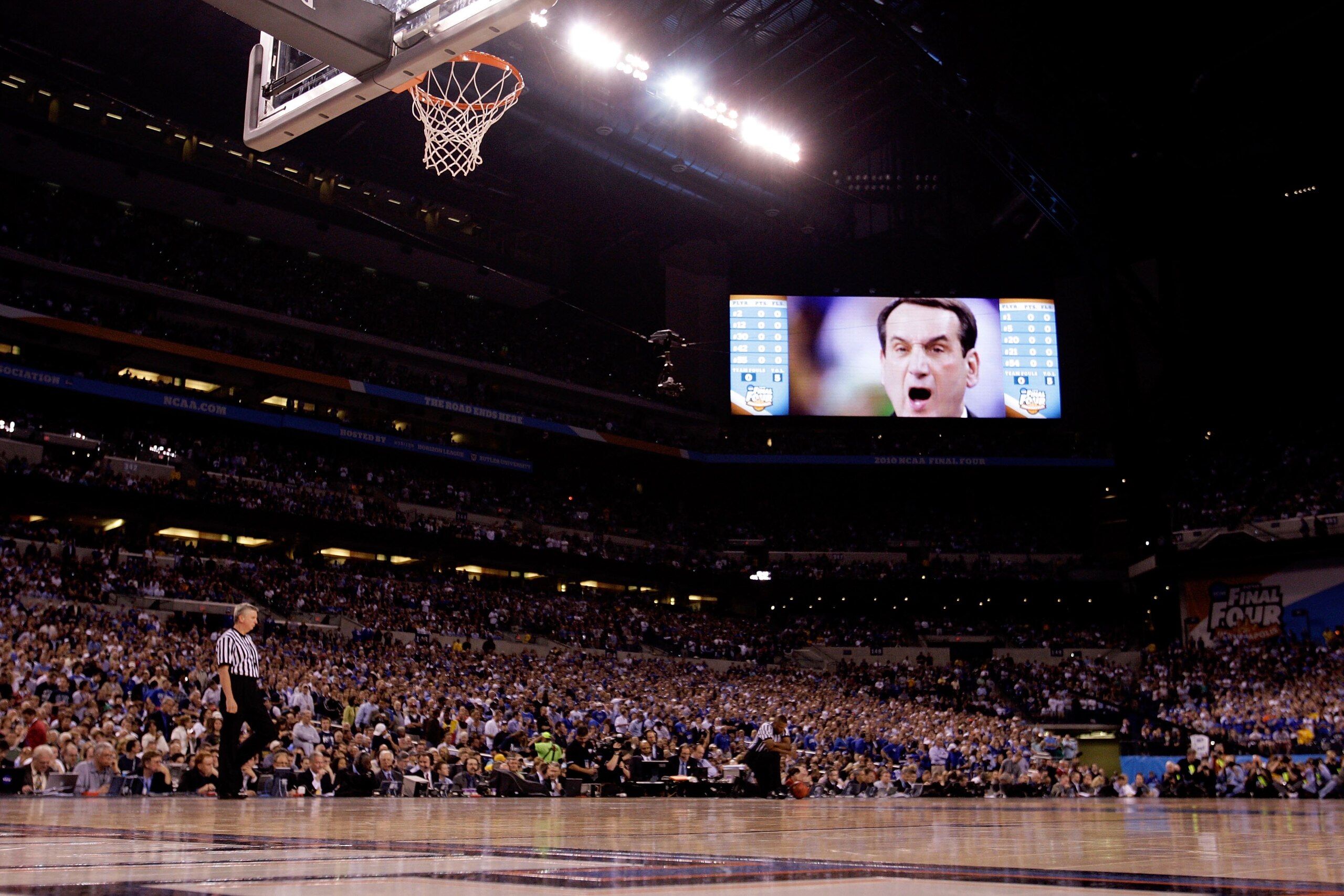 INDIANAPOLIS - APRIL 05:  The likeness of head coach Mike Krzyzewski of the Duke Blue Devils is seen on the giant video monitor against the Butler Bulldogs during the 2010 NCAA Division I Men's Basketball National Championship game at Lucas Oil Stadium on
