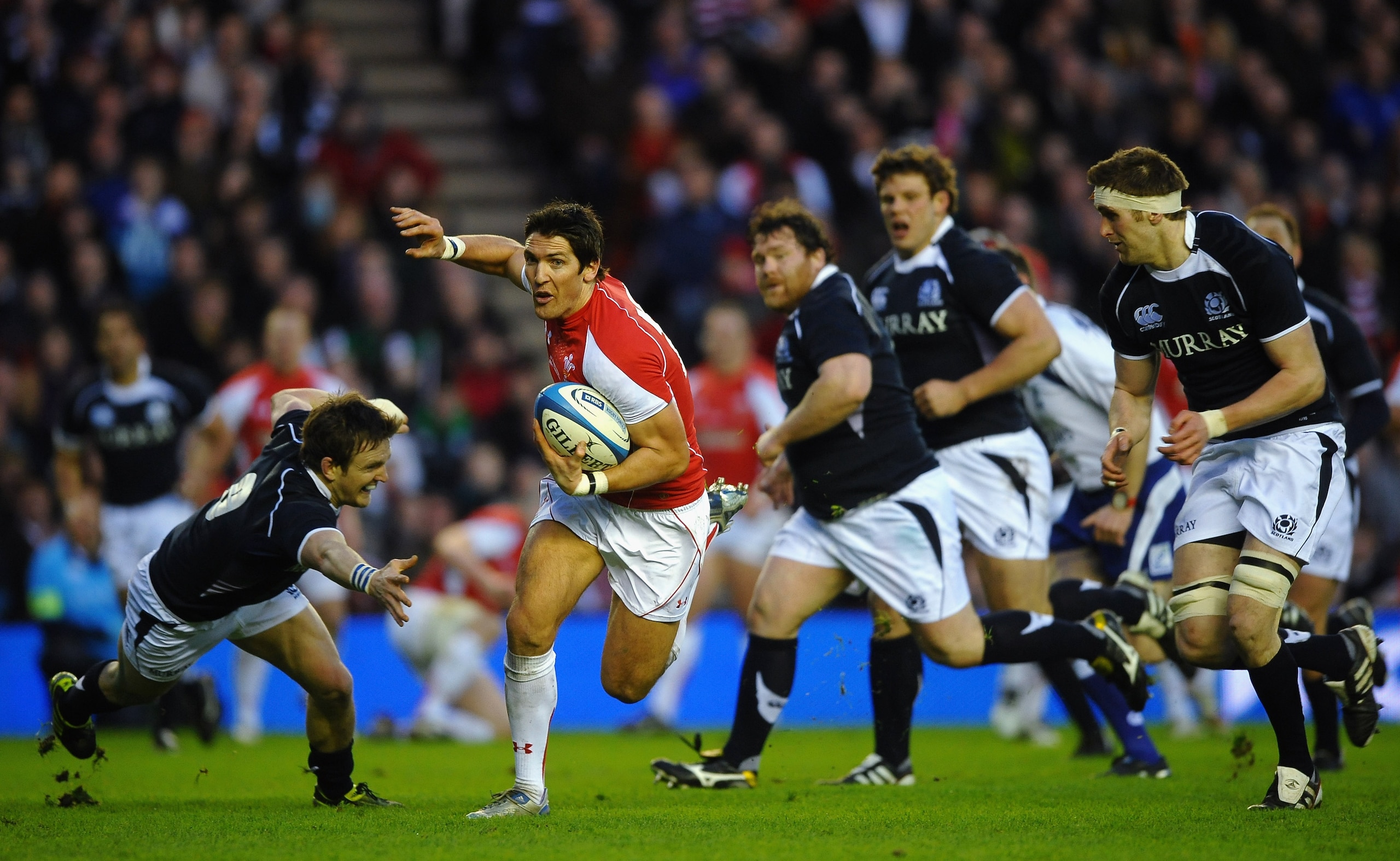 EDINBURGH, SCOTLAND - FEBRUARY 12:  James Hook of Wales beaks past Rory Lawson of Scotland during the RBS 6 Nations Championship match between Scotland and Wales at Murrayfield Stadium on February 12, 2011 in Edinburgh, Scotland.  (Photo by Laurence Griff