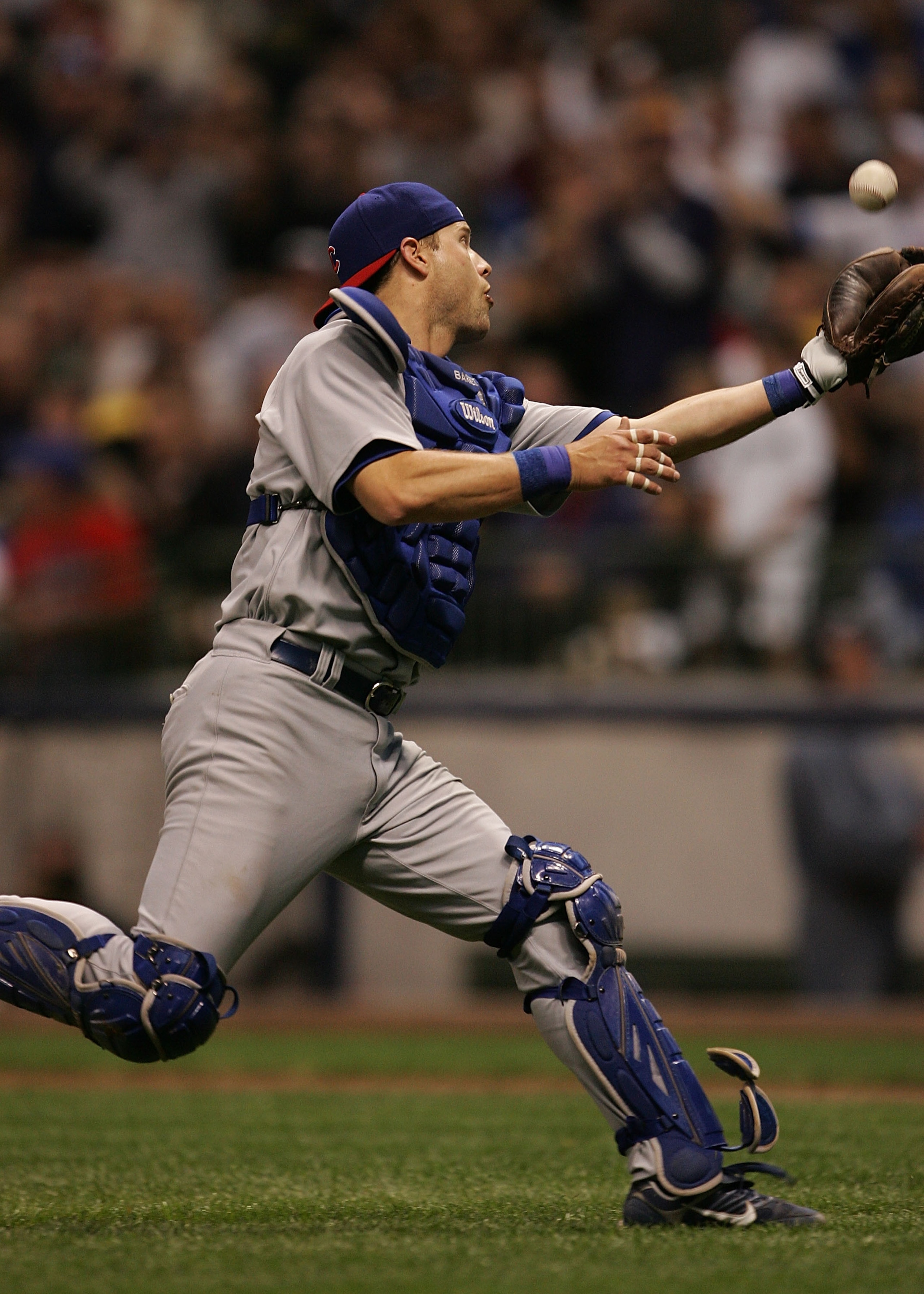 MILWAUKEE - JUNE 4: Michael Barrett #8 of the Chicago Cubs makes a catch of a ball hit by Corey Hart of the Milwaukee Brewers following a fielding error by the Cubs at Miller Park June 4, 2007 in Milwaukee, Wisconsin. (Photo by Jonathan Daniel/Getty Image