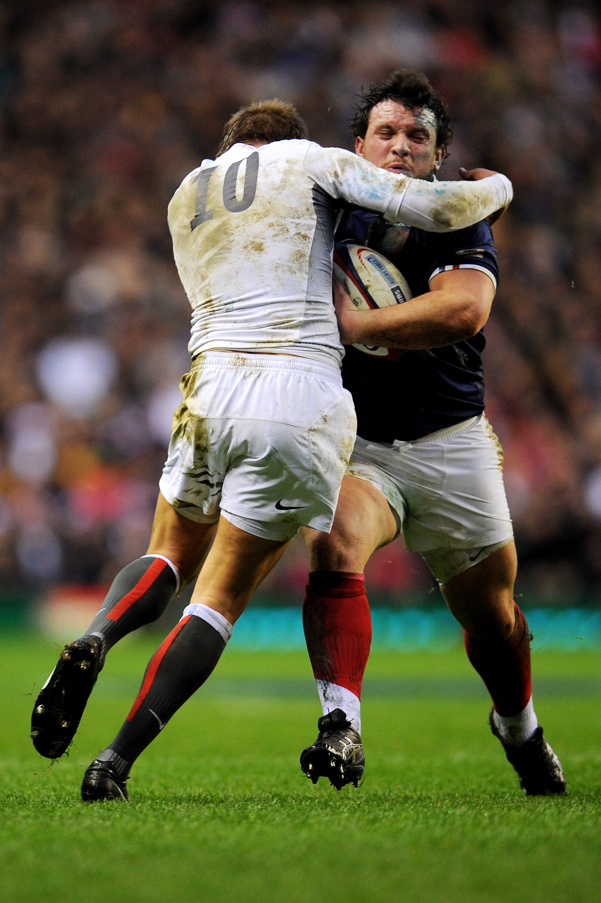 LONDON, ENGLAND - FEBRUARY 26:  Thomas Domingo of France is tackled by Toby Flood of England during the RBS 6 Nations Championship match between England and France at Twickenham Stadium on February 26, 2011 in London, England.  (Photo by Clive Mason/Getty