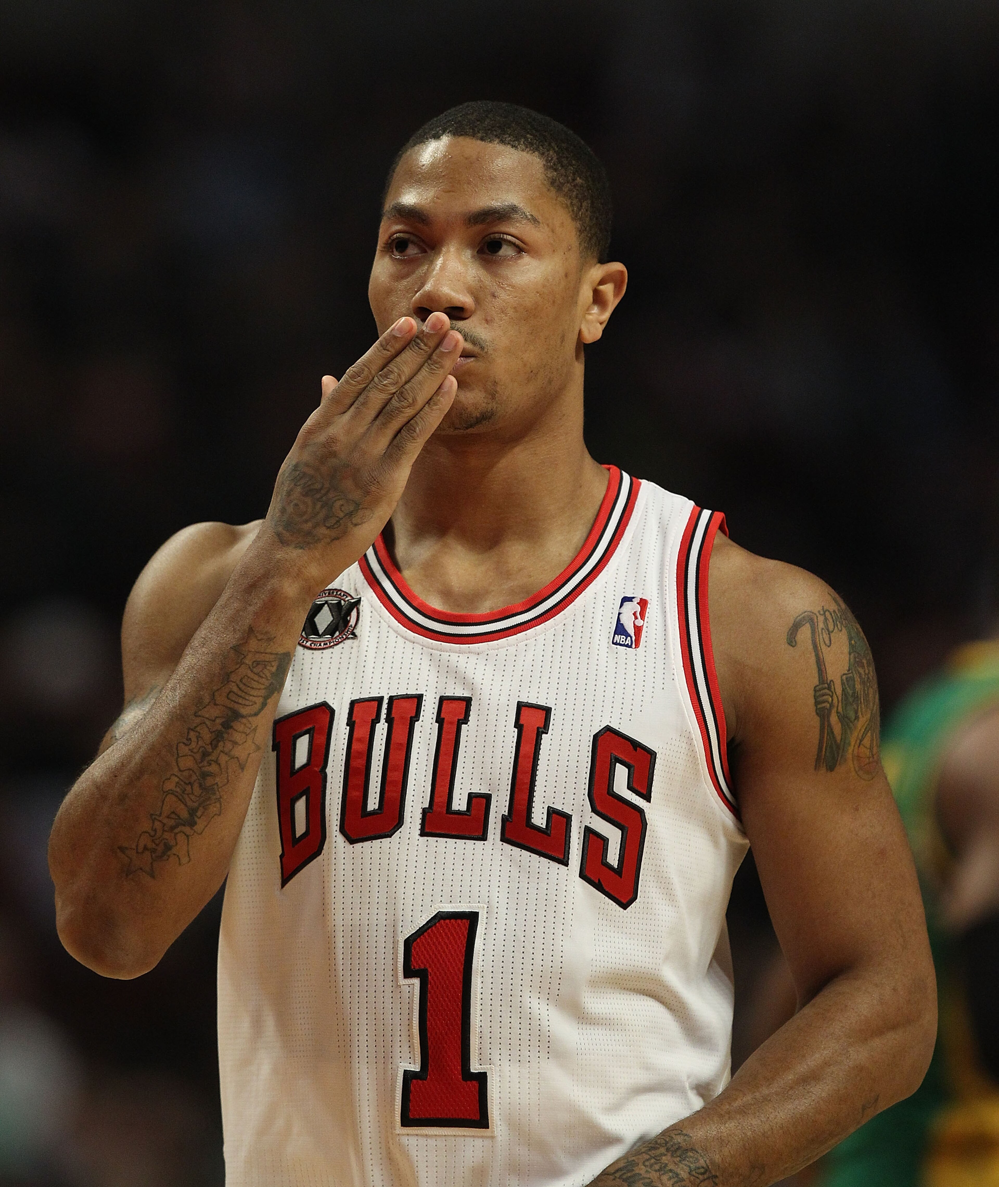 CHICAGO, IL - MARCH 07: Derrick Rose #1 of the Chicago Bulls blows a kiss to members of his family in the stands before the tip-off of a game against the New Orleans Hornets at the United Center on March 7, 2011 in Chicago, Illinois. NOTE TO USER: User ex CHICAGO, IL - MARCH 07: Derrick Rose #1 of the Chicago Bulls blows a kiss to members of his family in the stands before the tip-off of a game against the New Orleans Hornets at the United Center on March 7, 2011 in Chicago, Illinois. NOTE TO USER: User ex