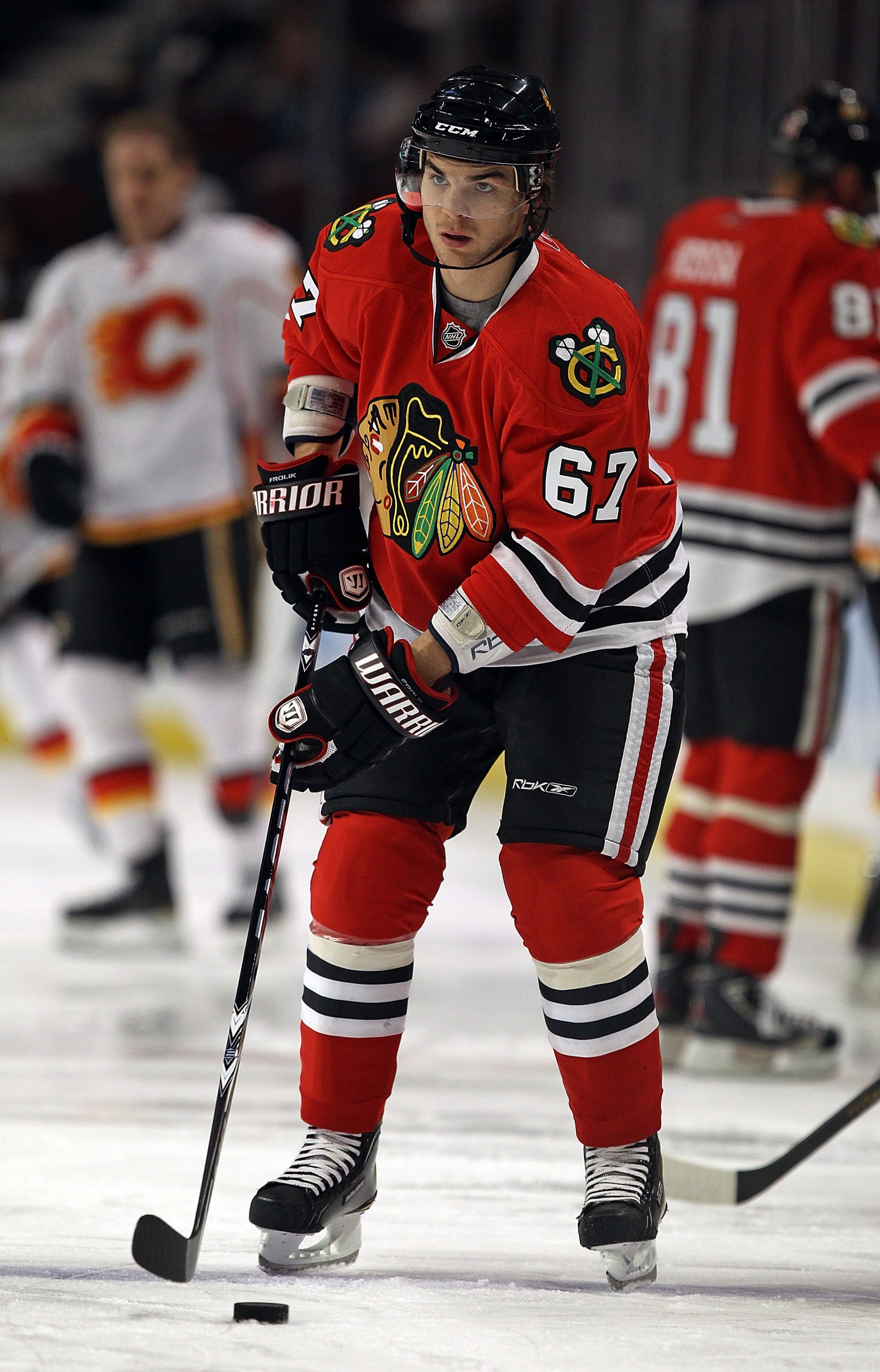 CHICAGO, IL - MARCH 02: Michael Frolik #67 of the Chicago Blackhawks participates in warm-ups before a game against the Calgary Flames at the United Center on March 2, 2011 in Chicago, Illinois. The Blackhawks defeated the Flames 5-2. (Photo by Jonathan D