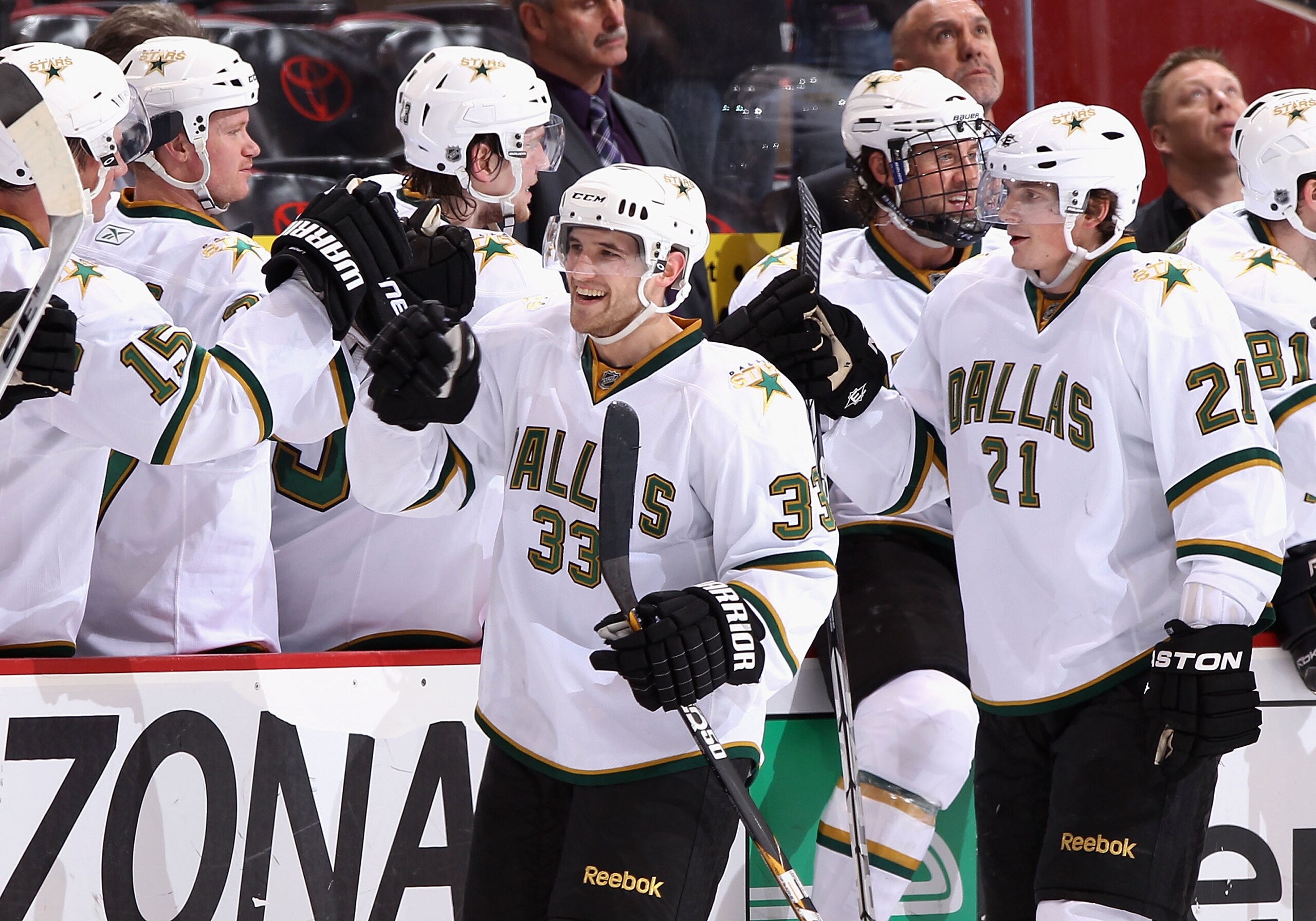 GLENDALE, AZ - MARCH 01:  Alex Goligoski #33 of the Dallas Stars celebrates with teammates on the bench during the NHL game against the Phoenix Coyotes at Jobing.com Arena on March 1, 2011 in Glendale, Arizona.  The Stars defeated the Coyotes 3-2.  (Photo