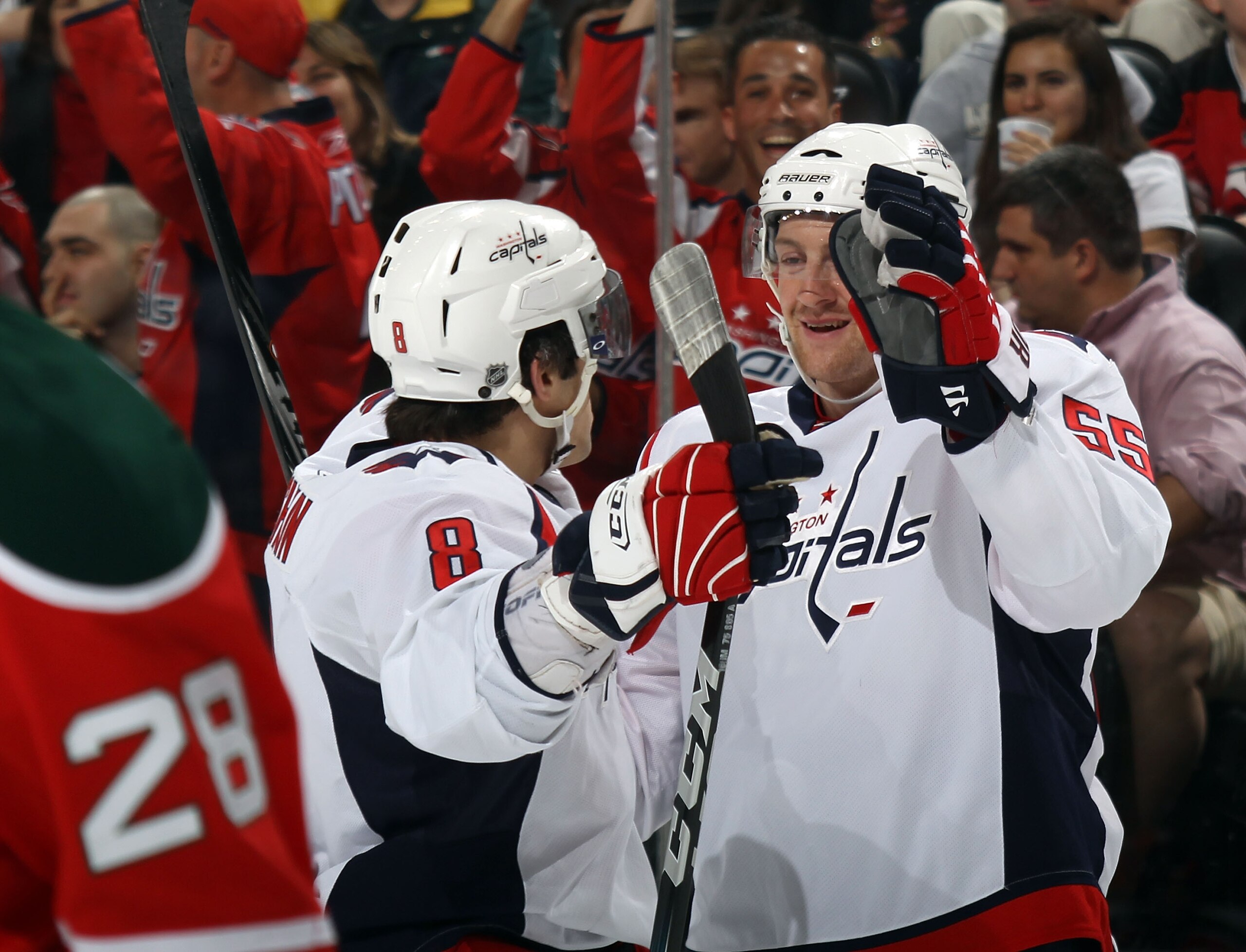 NEWARK, NJ - MARCH 18: Alex Ovechkin #8 of the Washington Capitals congratulates Jeff Schultz #55 of the Washington Capitals on his goal at 5:10 of the first period against the New Jersey Devils at the Prudential Center on March 18, 2011 in Newark, New Je