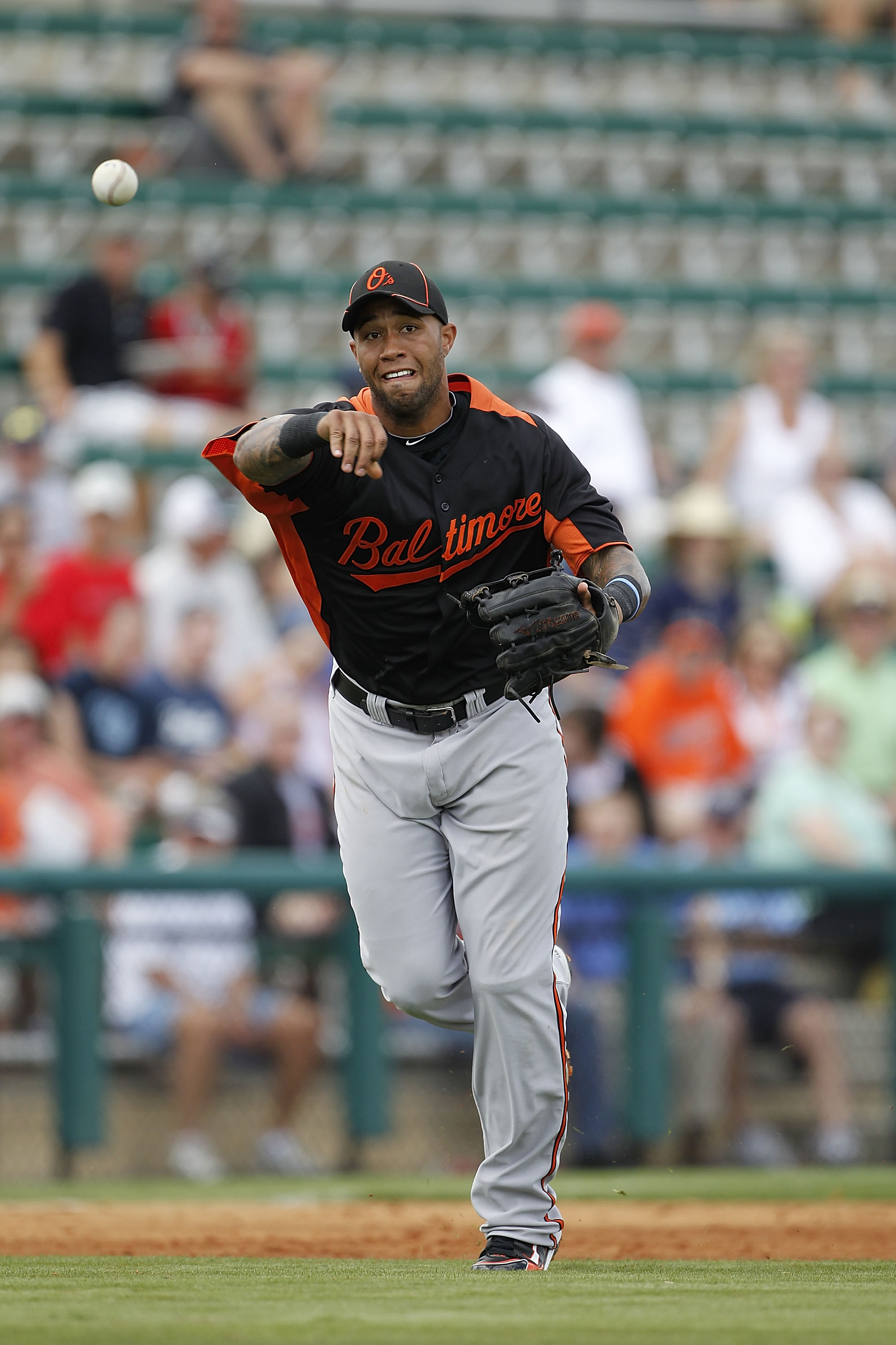 LAKELAND, FL - MARCH 04: Josh Bell #37 of the Baltimore Orioles throws to first base during the game against the Detroit Tigers at Joker Marchant Stadium on March 4, 2011 in Lakeland, Florida. The Orioles defeated the Tigers 6-2. Photo by Leon Halip/Getty