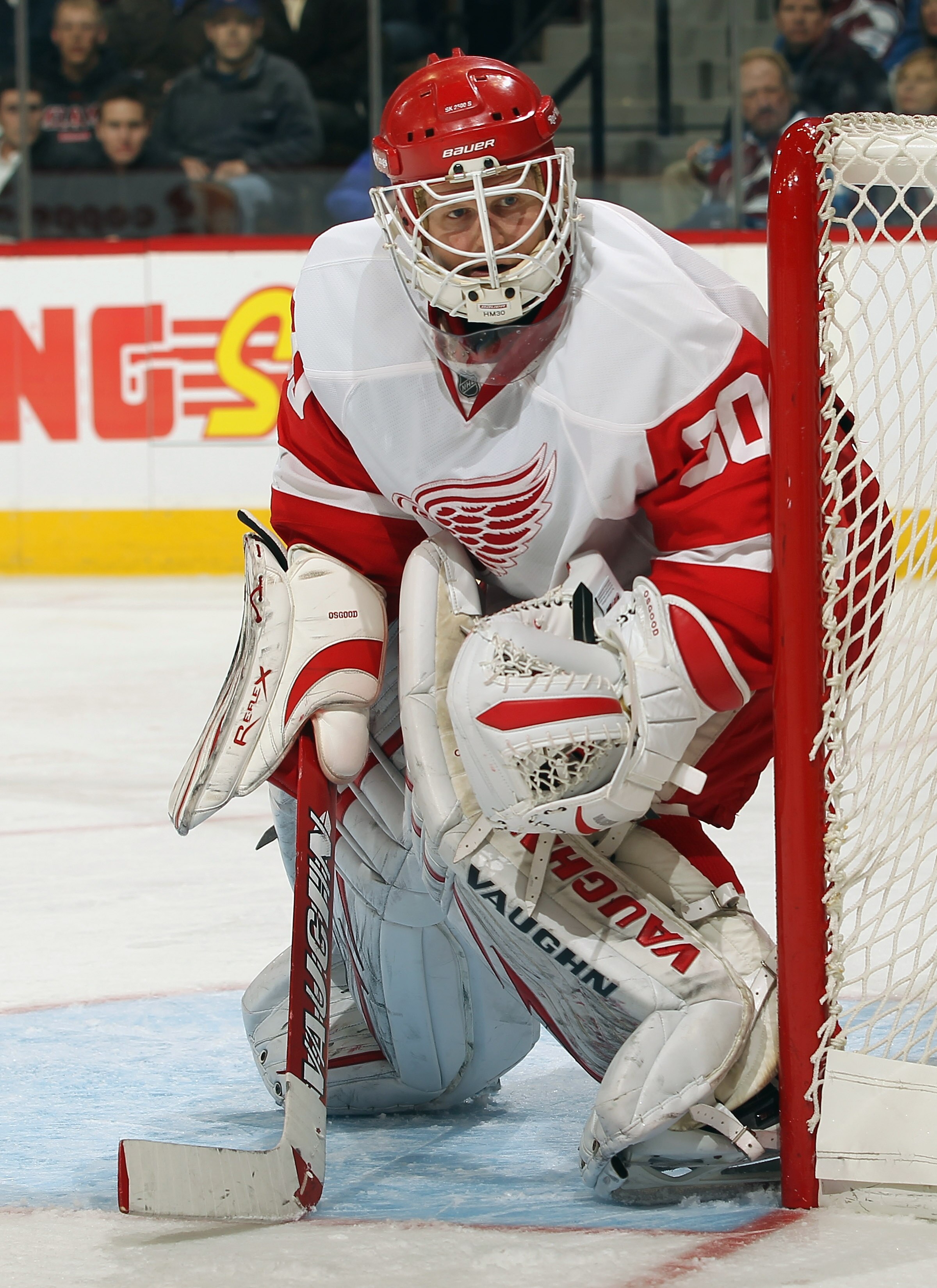 DENVER - DECEMBER 27:  Goalie Chris Osgood #30 of the Detroit Red Wings defends the goal against the Colorado Avalanche at the Pepsi Center on December 27, 2010 in Denver, Colorado. Osgood earned his 400th win and collected 46 saves as the Red Wings defea