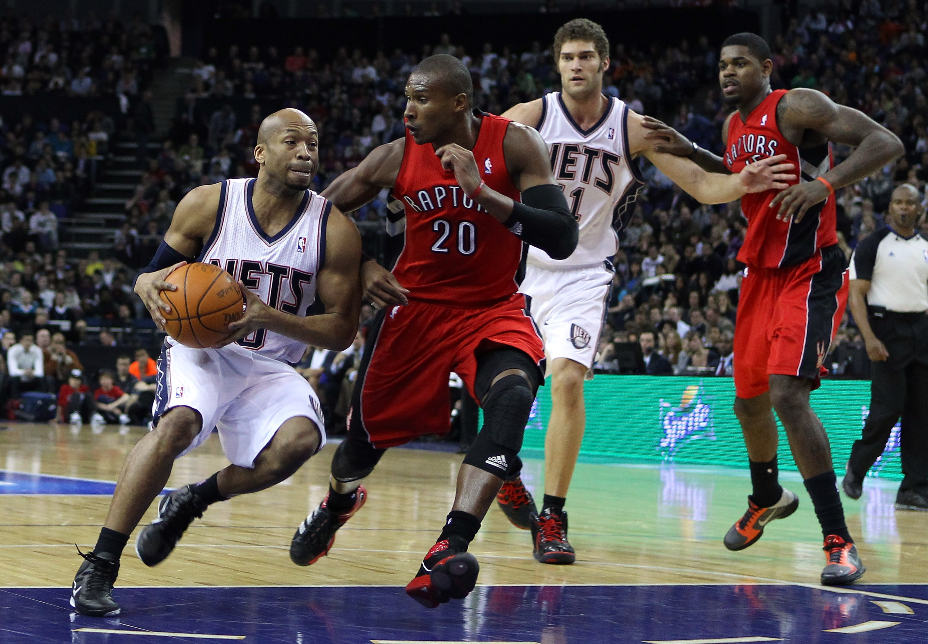 LONDON, ENGLAND - MARCH 04:  Sundiata Gaines of the Nets goes past Leandro Barbosa of the Raptors during the NBA match between New Jersey Nets and the Toronto Raptors at the O2 Arena on March 4, 2011 in London, England. NOTE TO USER: User expressly acknow