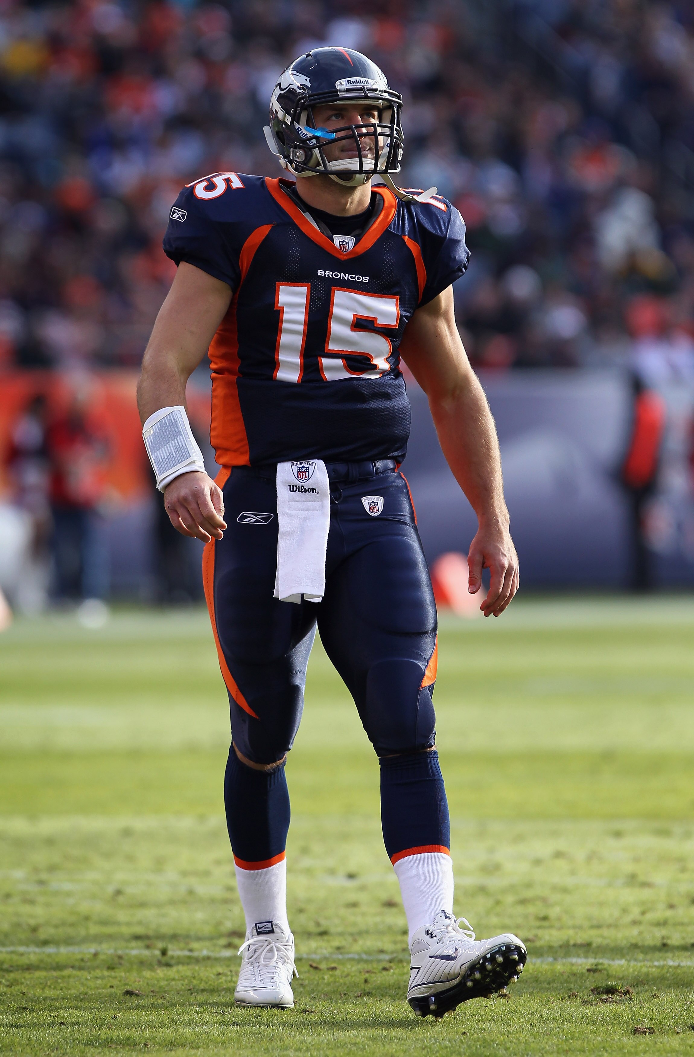 DENVER - DECEMBER 26:  Quarterback Tim Tebow #15 of the Denver Broncos looks on as he faces the Houston Texas at INVESCO Field at Mile High on December 26, 2010 in Denver, Colorado. The Broncos defeated the Texans 24-23.  (Photo by Doug Pensinger/Getty Im
