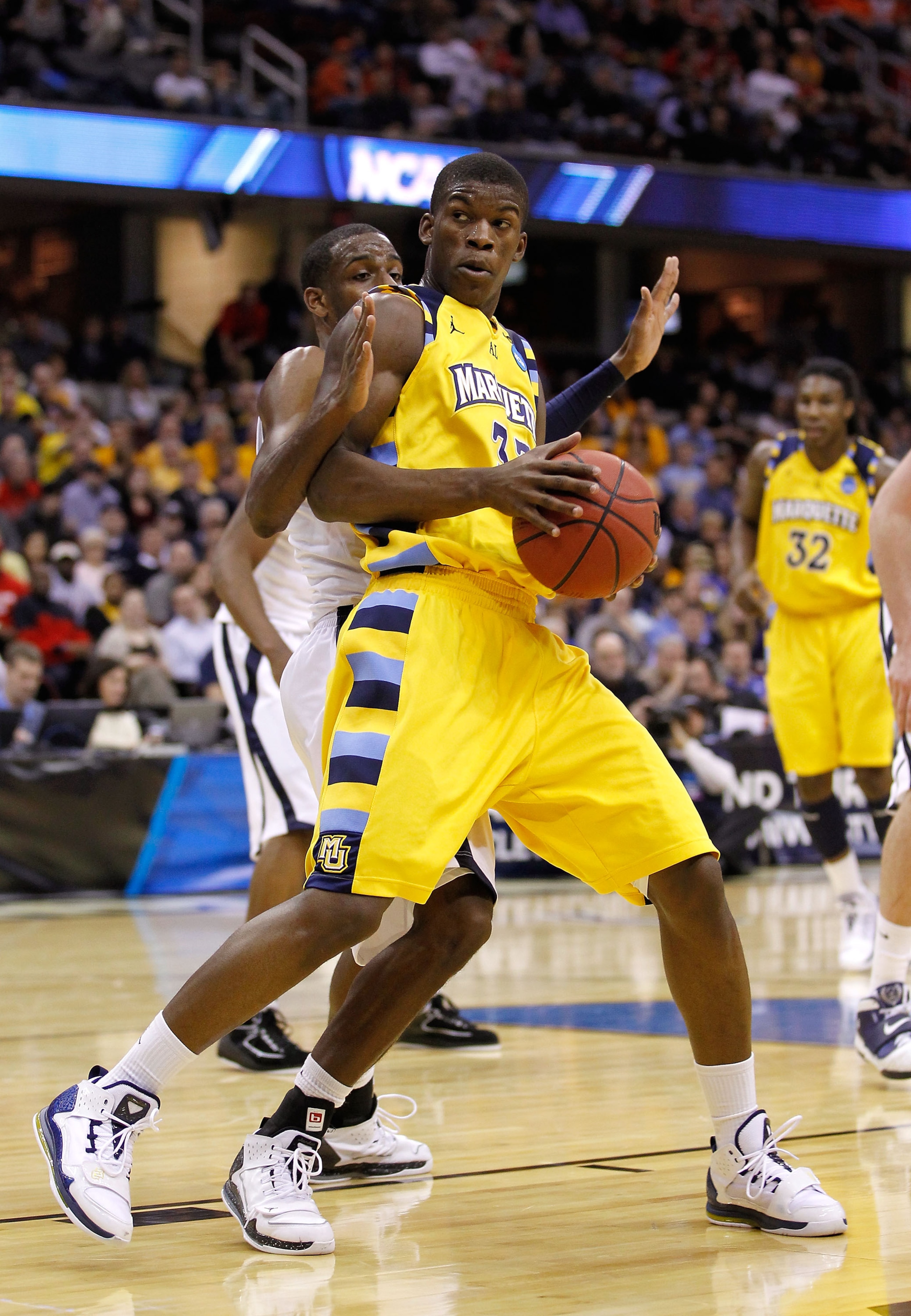CLEVELAND, OH - MARCH 18: Jimmy Butler #33 of the Marquette Golden Eagles handles the ball against Dante Jackson #25 of the Xavier Musketeers during the second round of the 2011 NCAA men's basketball tournament at Quicken Loans Arena on March 18, 2011 in