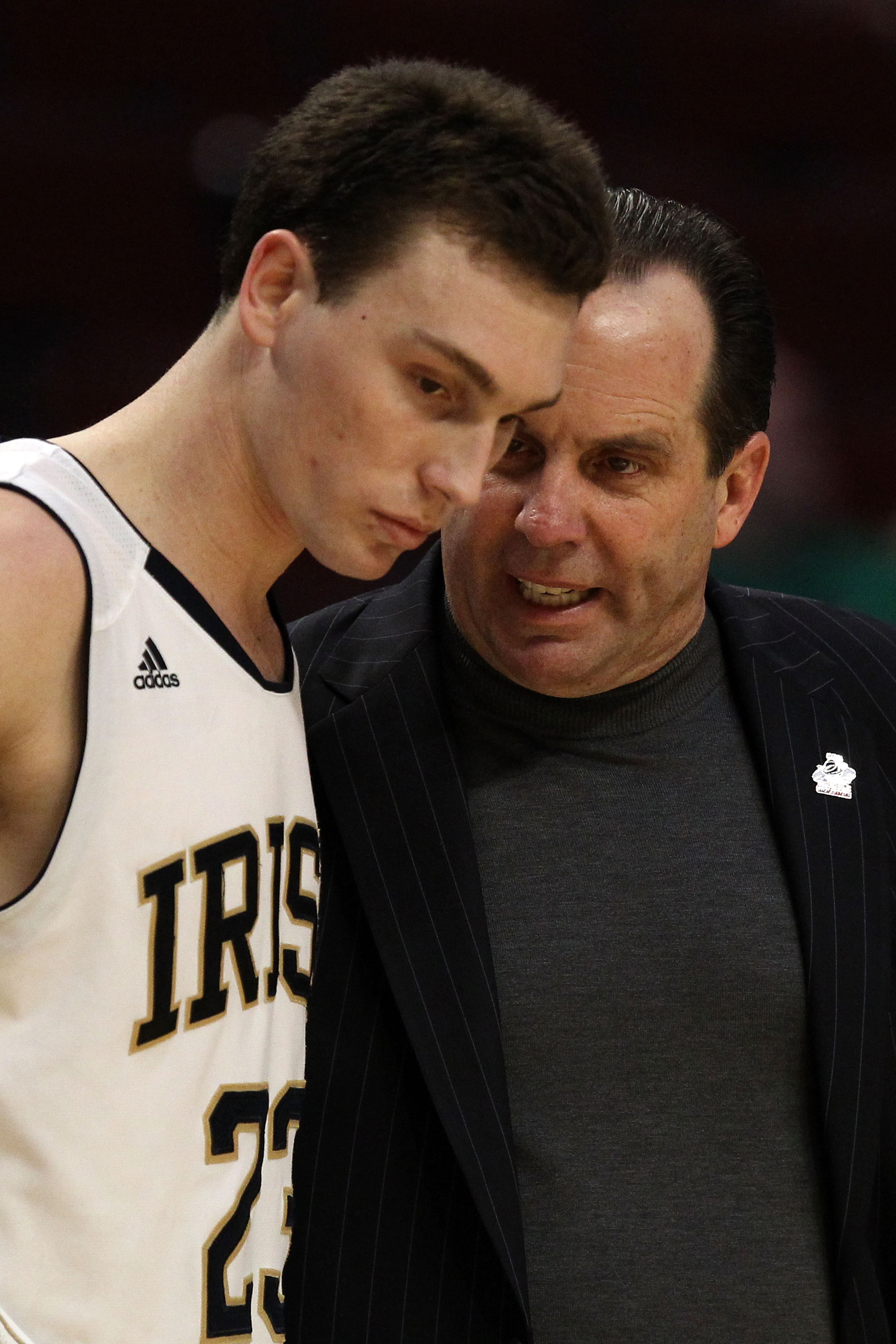 CHICAGO, IL - MARCH 20:  Head coach Mike Brey of the Notre Dame Fighting Irish talks with Ben Hansbrough #23 after he fouled out in the second half of the game against the Florida State Seminoles during the third round of the 2011 NCAA men's basketball to