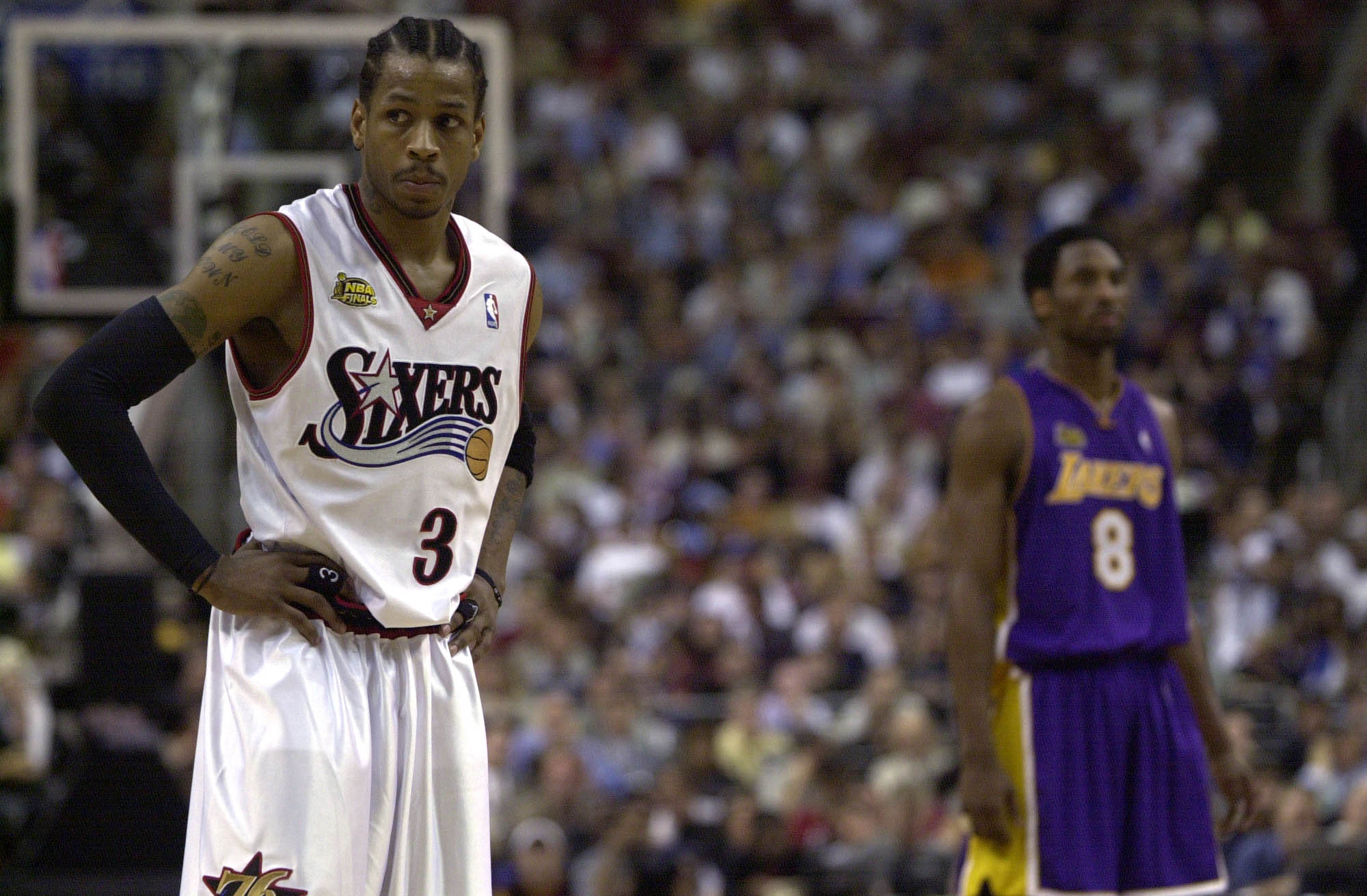15 Jun 2001:  Allen Iverson #3 of the Philadelphia 76ers looks on (with Kobe Bryant #8 in the background) in game five of the NBA Finals against the Los Angeles Lakers at the First Union Center in Philadelphia, Pennsylvania.  The Lakers won 108-86 to take
