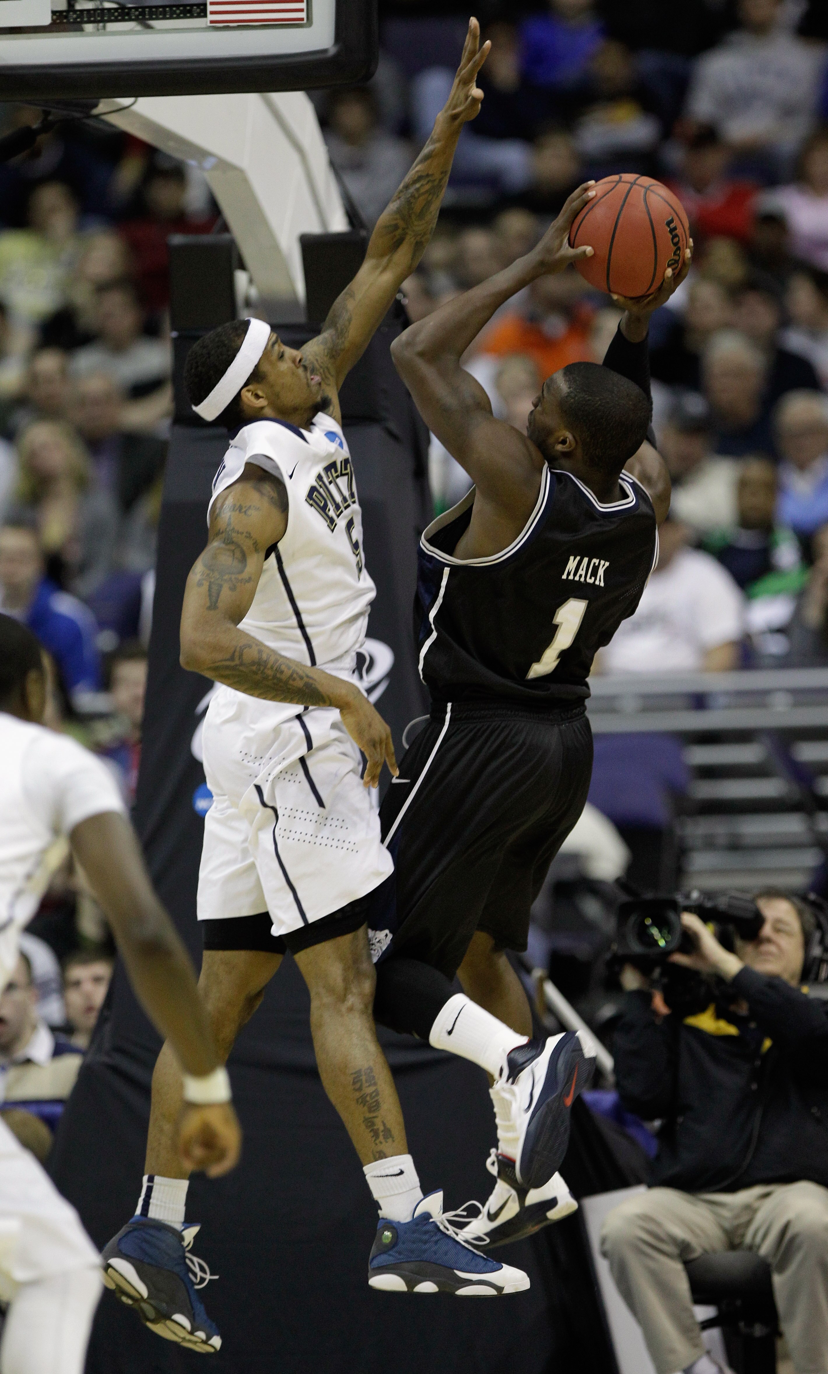 WASHINGTON - MARCH 19: Shelvin Mack #1 of the Butler Bulldogs puts up a shot against Gilbert Brown #5 of the Pittsburgh Panthers during the third round of the 2011 NCAA men's basketball tournament at Verizon Center on March 19, 2011 in Washington, DC.  (P