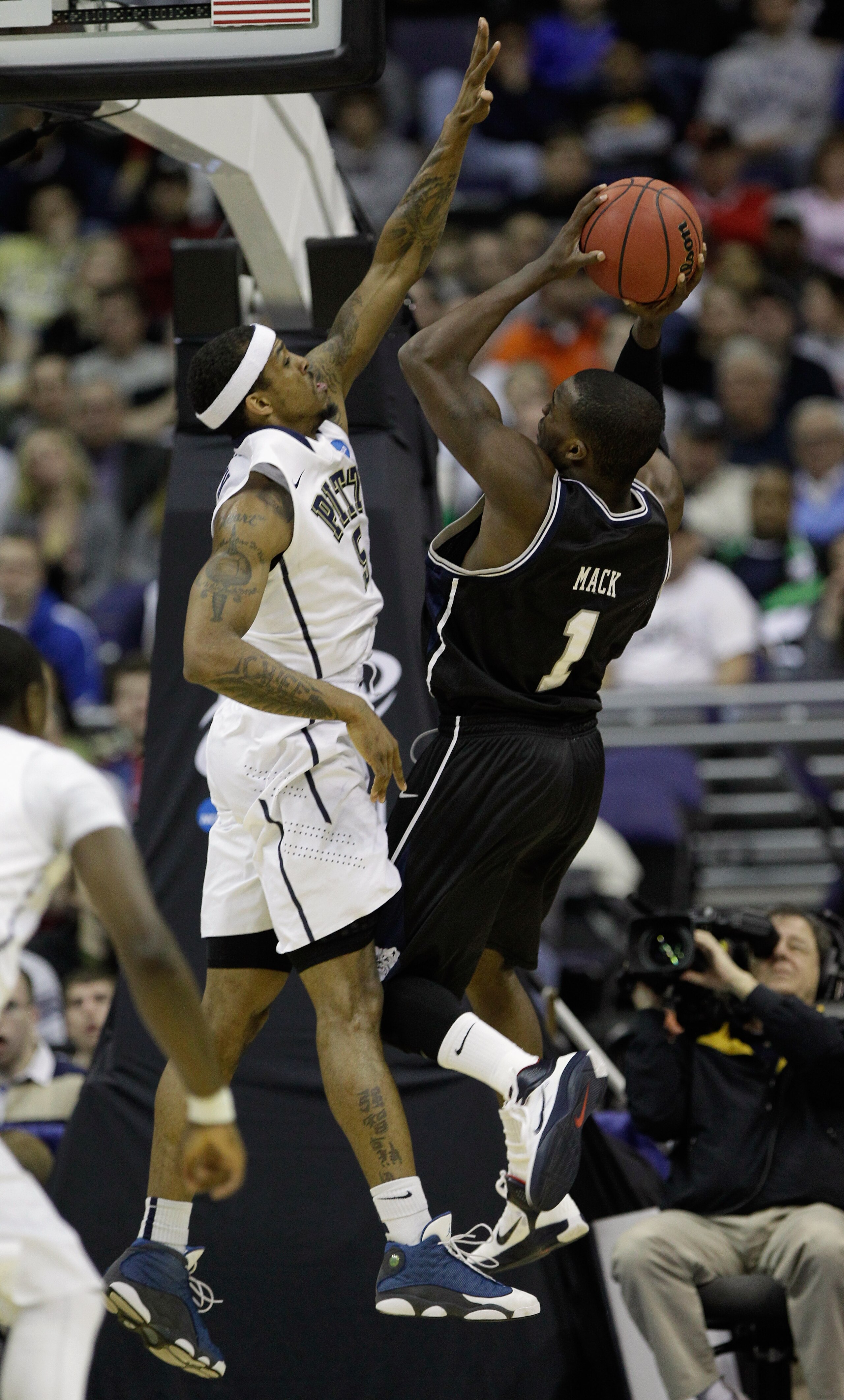 WASHINGTON - MARCH 19: Shelvin Mack #1 of the Butler Bulldogs puts up a shot against Gilbert Brown #5 of the Pittsburgh Panthers during the third round of the 2011 NCAA men's basketball tournament at Verizon Center on March 19, 2011 in Washington, DC.  (P