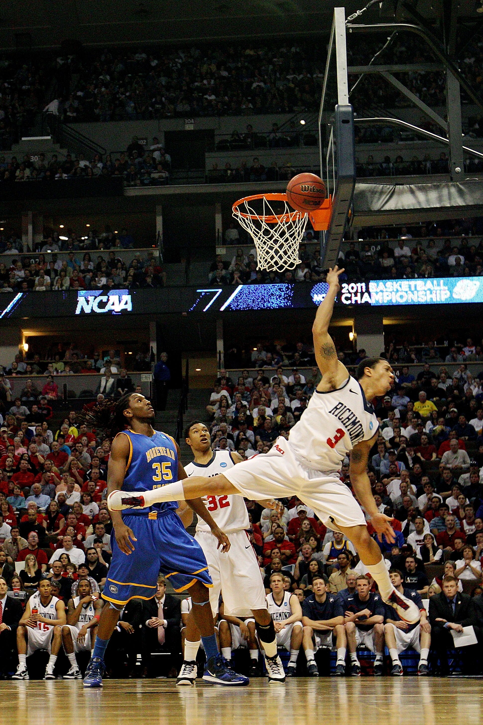 DENVER, CO - MARCH 19:  Darien Brothers #3 of the Richmond Spiders goes to the basket against Kenneth Faried #35 of the Morehead State Eagles during the third round of the 2011 NCAA men's basketball tournament at Pepsi Center on March 19, 2011 in Denver,