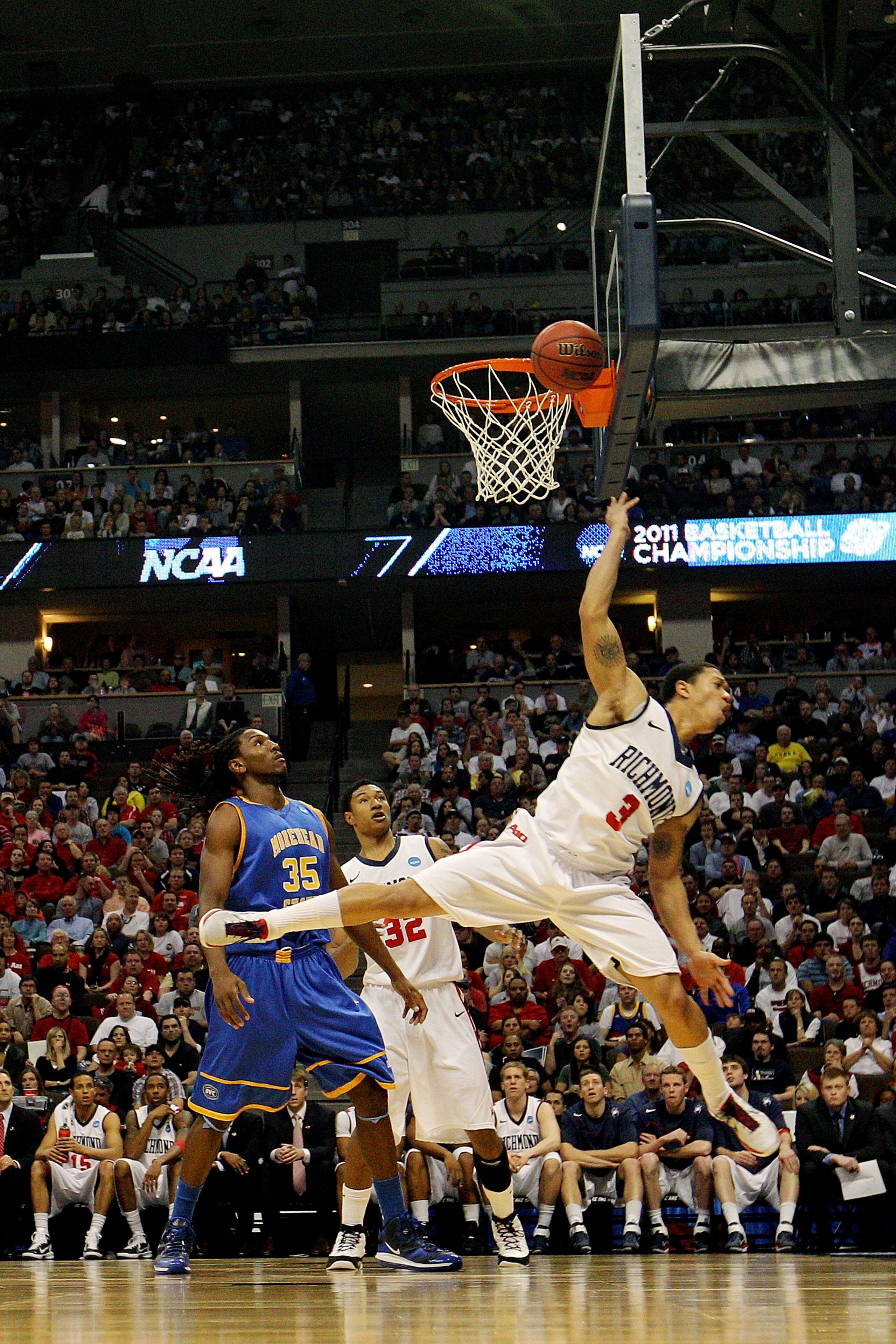 DENVER, CO - MARCH 19:  Darien Brothers #3 of the Richmond Spiders goes to the basket against Kenneth Faried #35 of the Morehead State Eagles during the third round of the 2011 NCAA men's basketball tournament at Pepsi Center on March 19, 2011 in Denver,