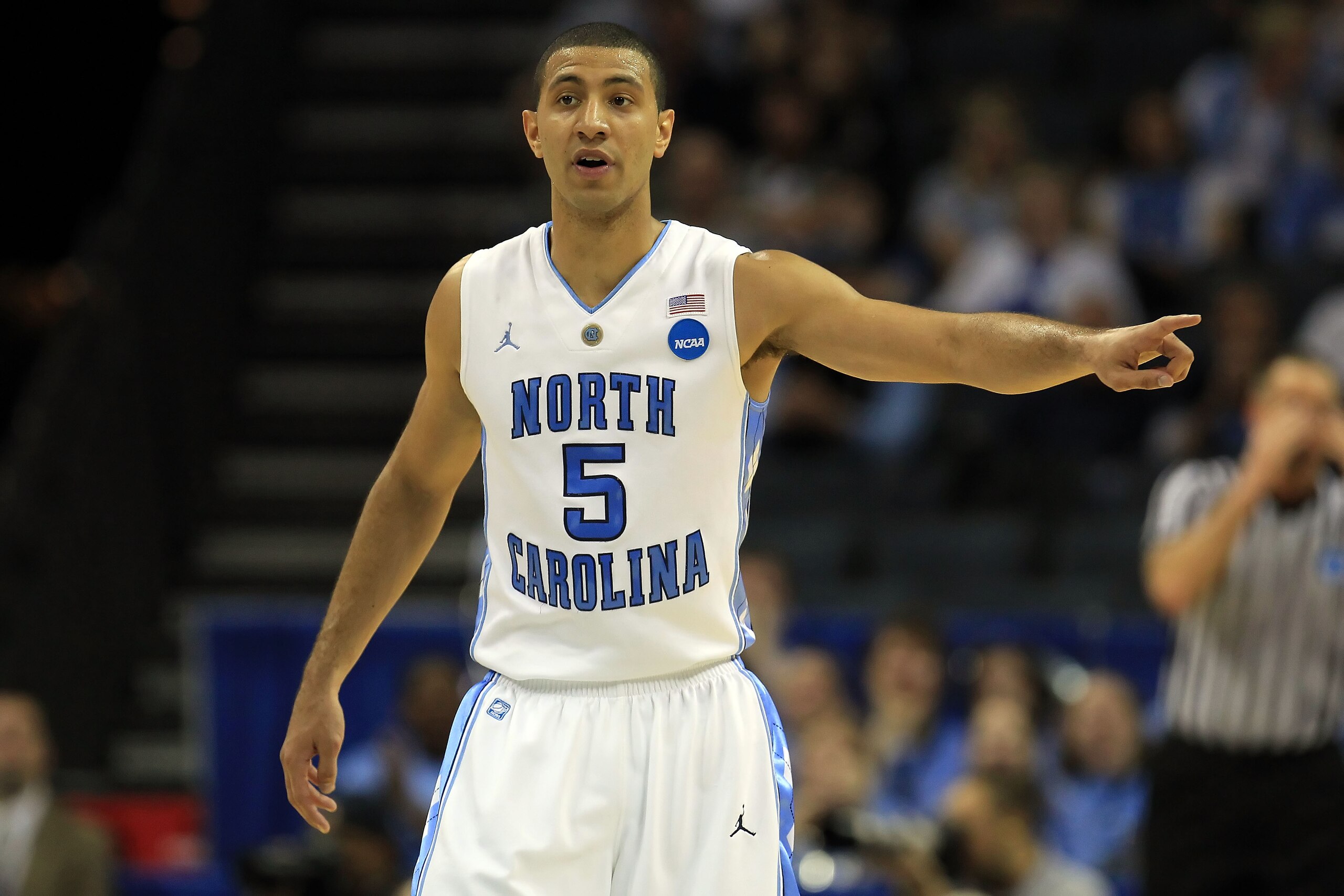 CHARLOTTE, NC - MARCH 20:  Kendall Marshall #5 of the North Carolina Tar Heels points while taking on the Washington Huskies in the first half during the third round of the 2011 NCAA men's basketball tournament at Time Warner Cable Arena on March 20, 2011