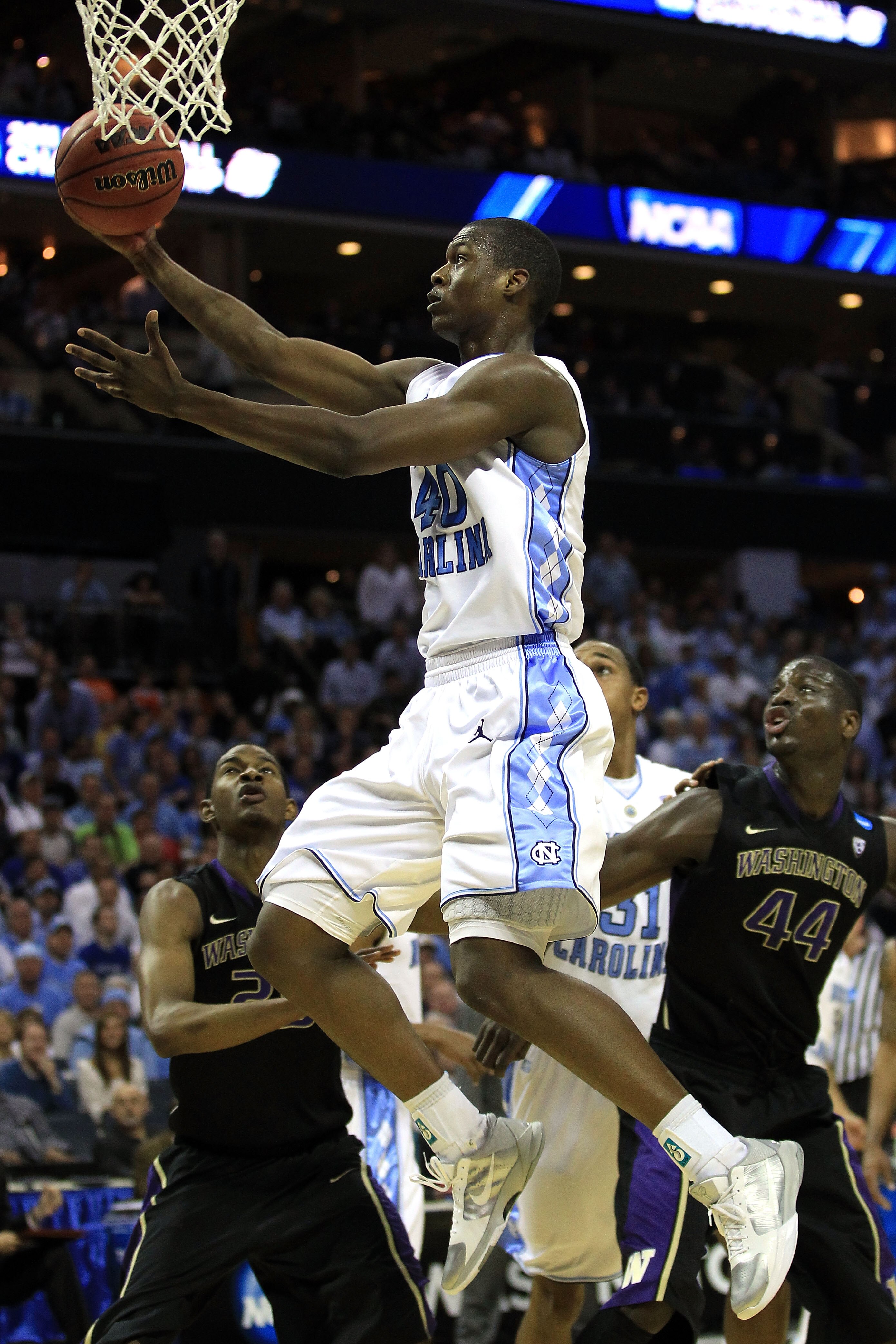 CHARLOTTE, NC - MARCH 20:  Harrison Barnes #40 of the North Carolina Tar Heels lays the ball up while taking on the Washington Huskies during the third round of the 2011 NCAA men's basketball tournament at Time Warner Cable Arena on March 20, 2011 in Char