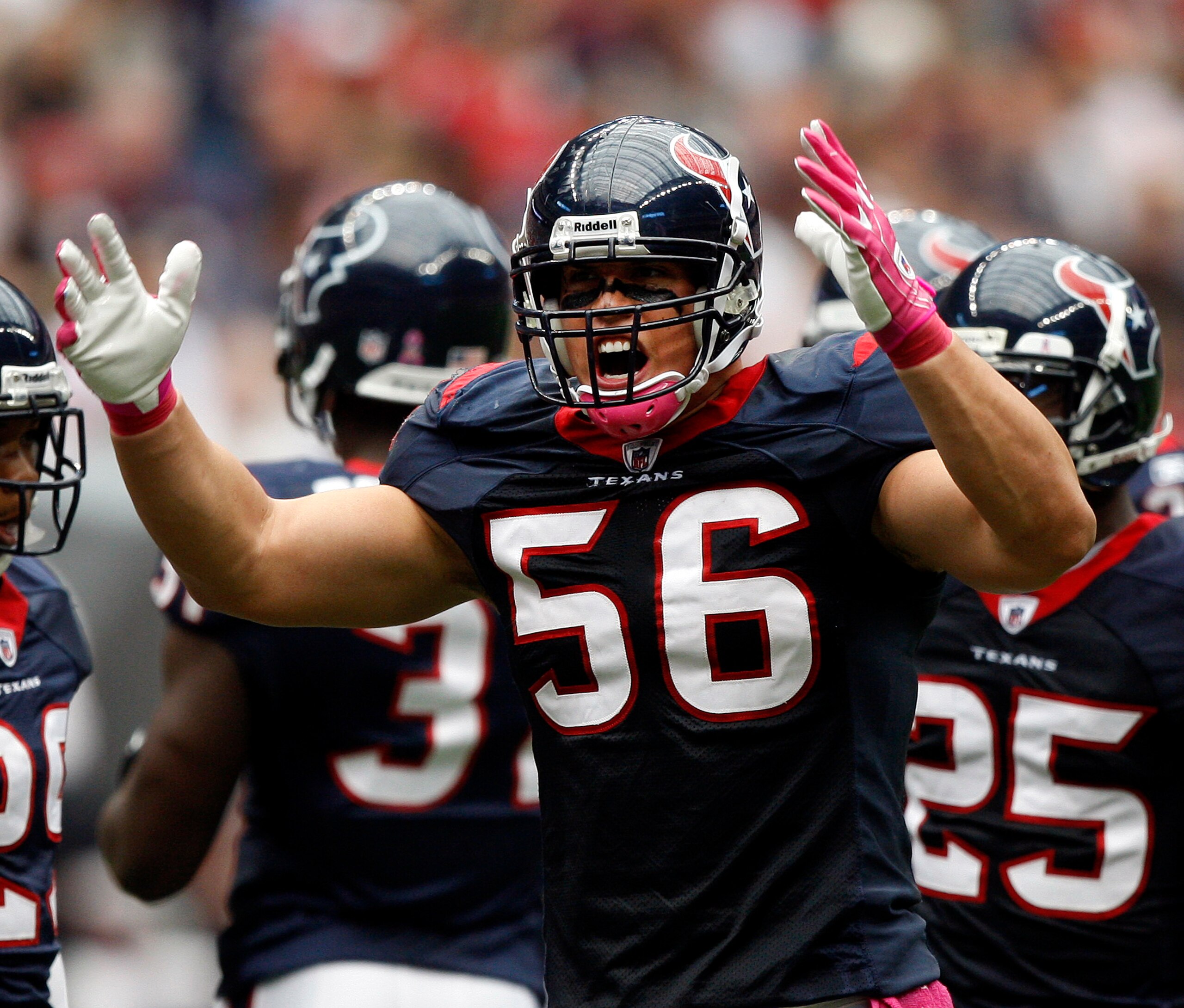 HOUSTON - OCTOBER 10:  Linebacker Brian Cushing #56 of the Houston Texans tries to get the crowd into the game against the New York Giants at Reliant Stadium on October 10, 2010 in Houston, Texas.  (Photo by Bob Levey/Getty Images)