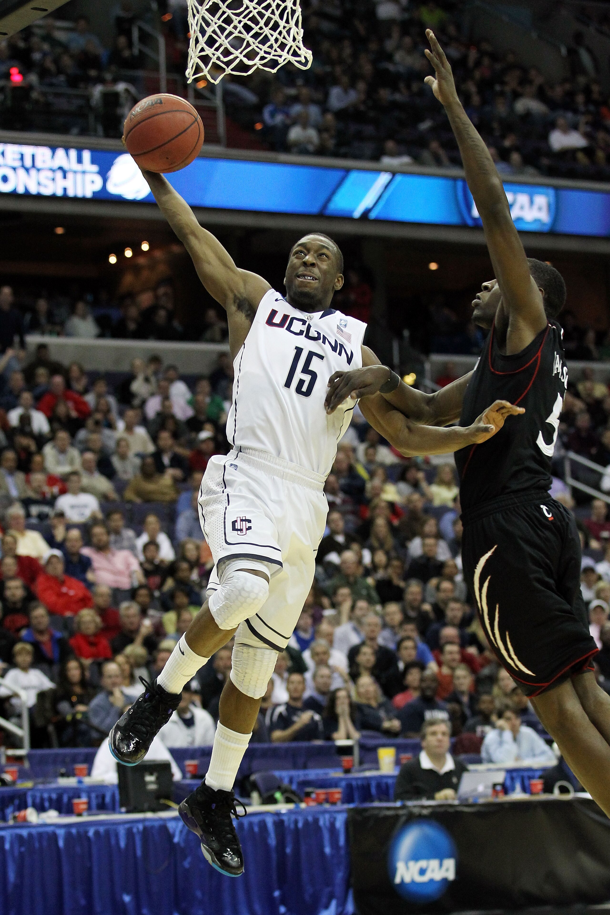 WASHINGTON - MARCH 19:  Kemba Walker #15 of the Connecticut Huskies goes in for a layup against the Cincinnati Bearcats during the third round of the 2011 NCAA men's basketball tournament at Verizon Center on March 19, 2011 in Washington, DC.  (Photo by N