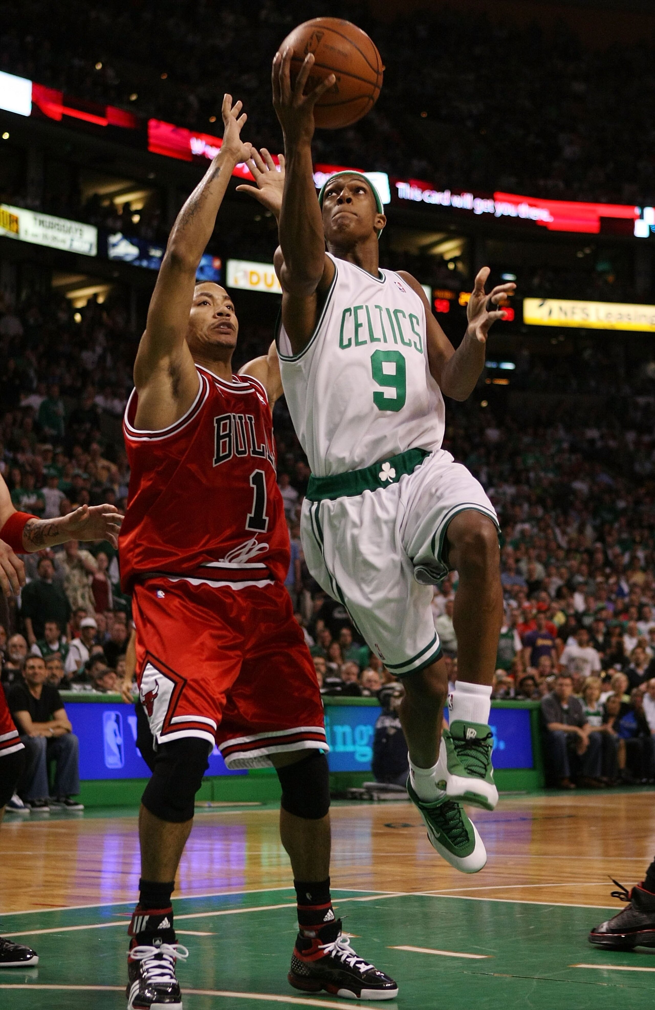 BOSTON - MAY 02:  Rajon Rondo #9 of the Boston Celtics drives past Derrick Rose #1 of the Chicago Bulls  in Game Seven of the Eastern Conference Quarterfinals during the 2009 NBA Playoffs at TD Banknorth Garden on May 2, 2009 in Boston, Massachusetts. NOT