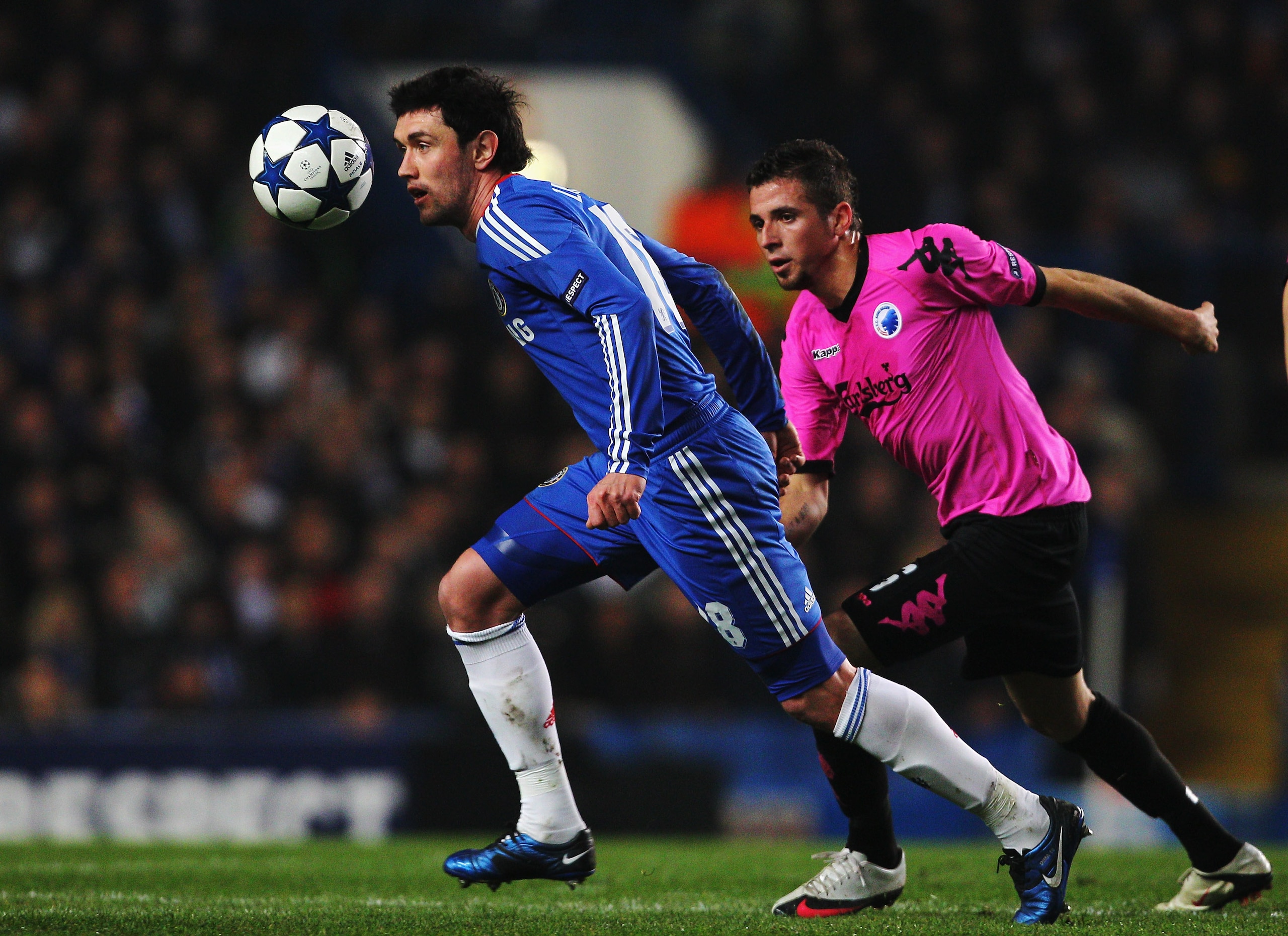 LONDON, UNITED KINGDOM - MARCH 16:  Yuri Zhirkov (L) of Chelsea holds off Claudemir (R) of FC Copenhagen during the UEFA Champions League round of sixteen second leg match between Chelsea and FC Copenhagen at Stamford Bridge on March 16, 2011 in London, E