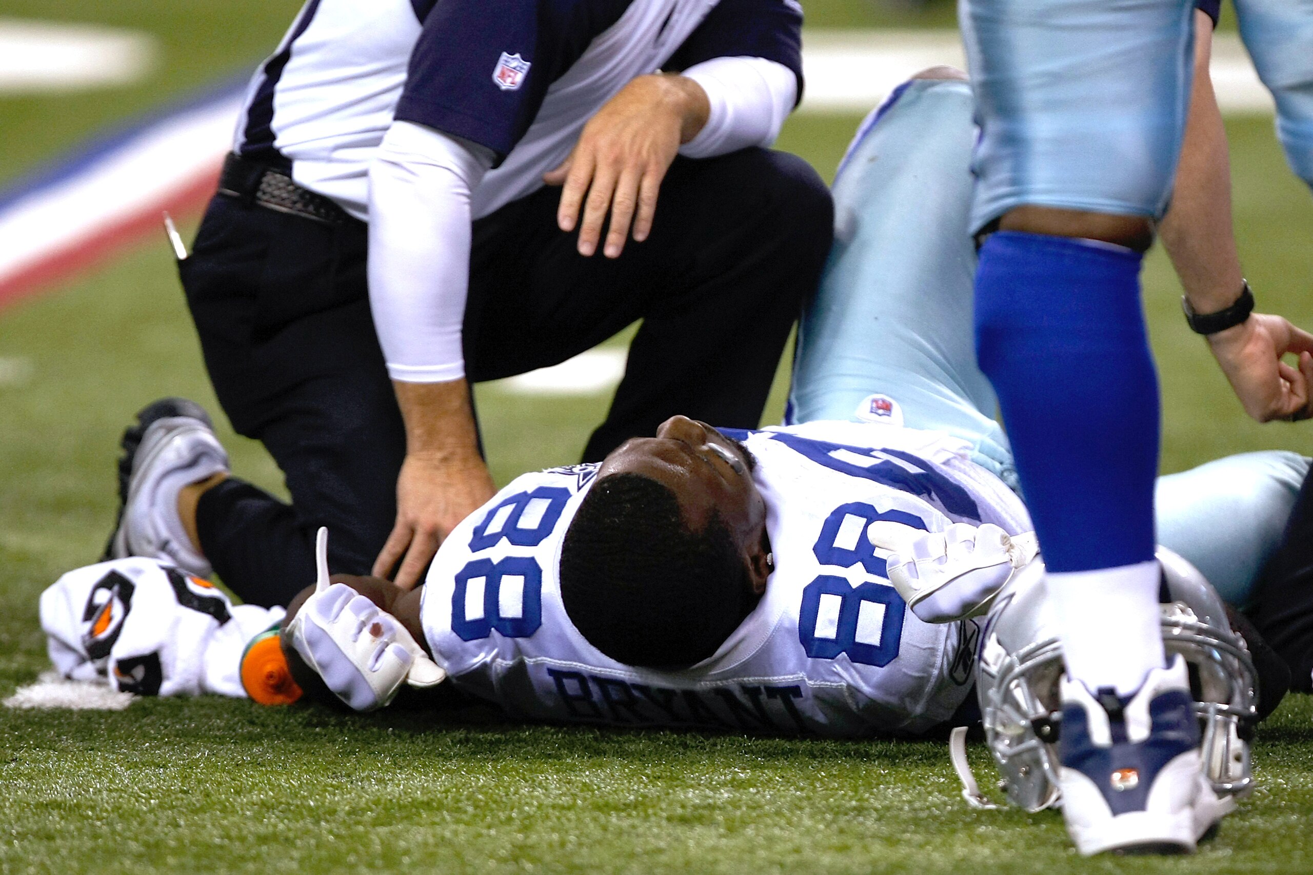INDIANAPOLIS, IN - DECEMBER 05: Dez Bryant #88 of the Dallas Cowboys lays on thew field injured against the Indianapolis Colts at Lucas Oil Stadium on December 5, 2010 in Indianapolis, Indiana. The Cowboys defeated the Colts 38-35 in overtime (Photo by Sc INDIANAPOLIS, IN - DECEMBER 05: Dez Bryant #88 of the Dallas Cowboys lays on thew field injured against the Indianapolis Colts at Lucas Oil Stadium on December 5, 2010 in Indianapolis, Indiana. The Cowboys defeated the Colts 38-35 in overtime (Photo by Sc