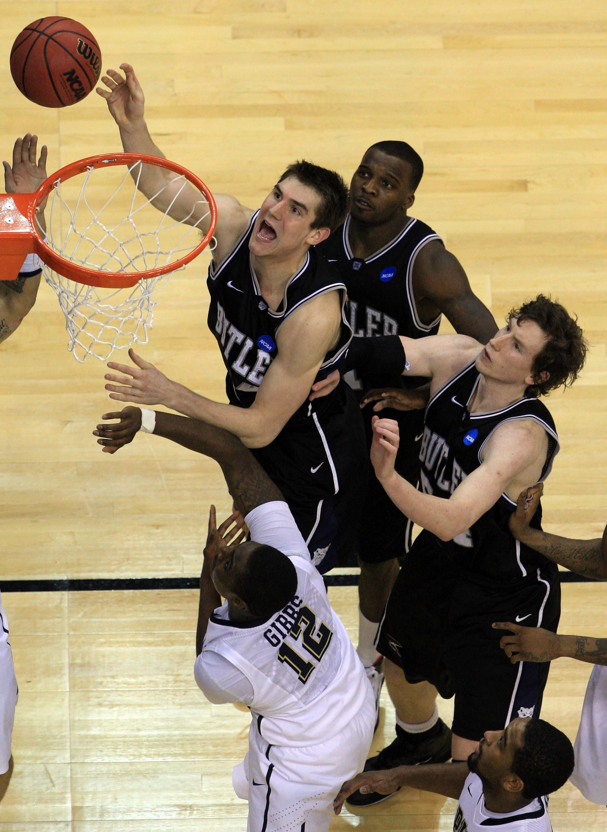 WASHINGTON - MARCH 19:  Andrew Smith #44 of the Butler Bulldogs puts up a shot against Ashton Gibbs #12 of the Pittsburgh Panthers during the third round of the 2011 NCAA men's basketball tournament at Verizon Center on March 19, 2011 in Washington, DC. B
